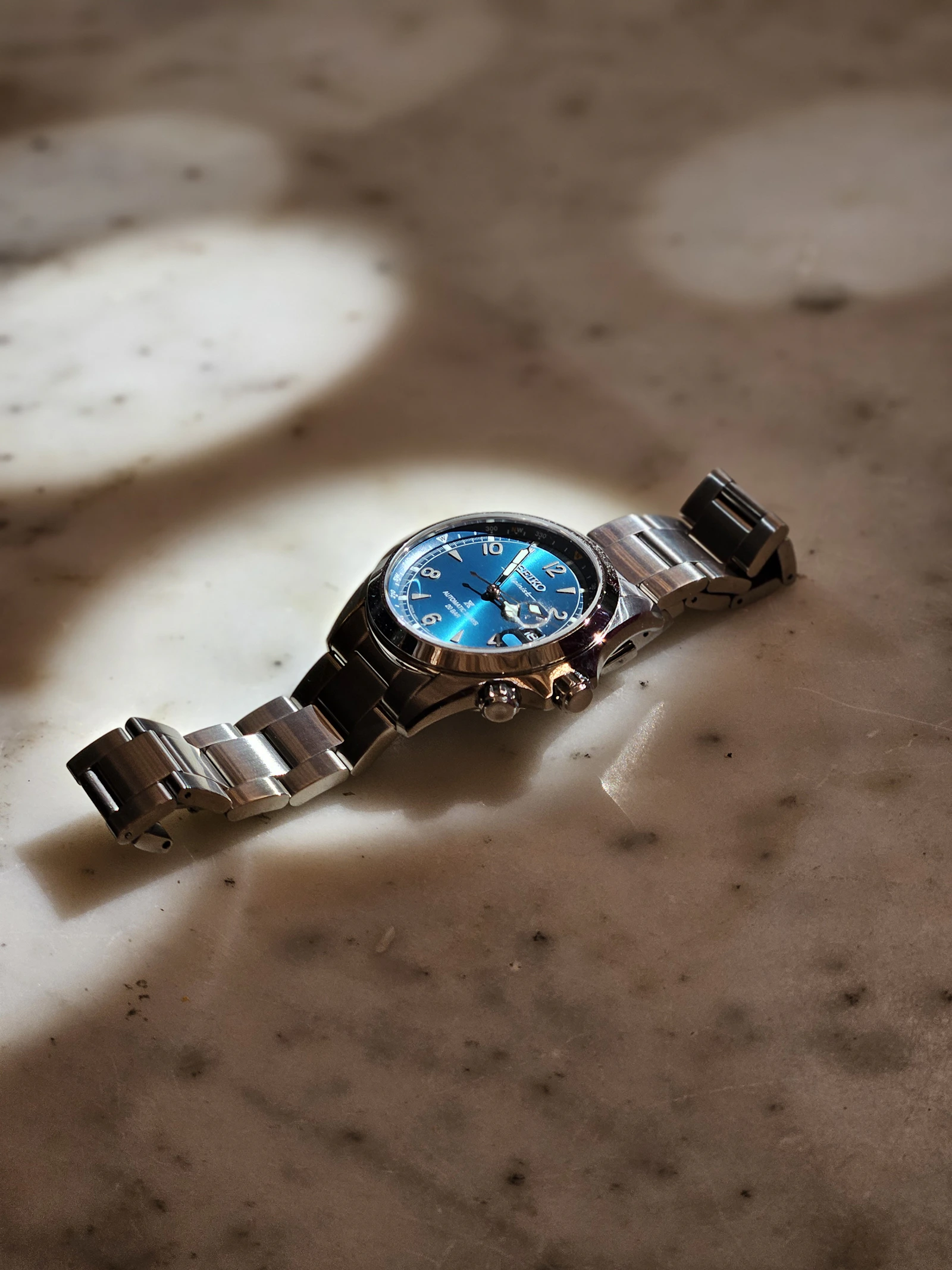Seiko blue dial dress watch on marble