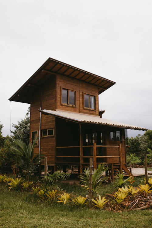 Rustic wooden cabin in greenery