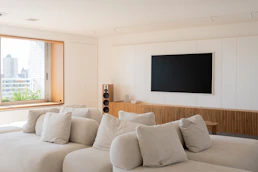 Modern living room with large sectional sofa and tv.