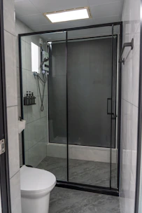 Modern bathroom with glass shower and toilet