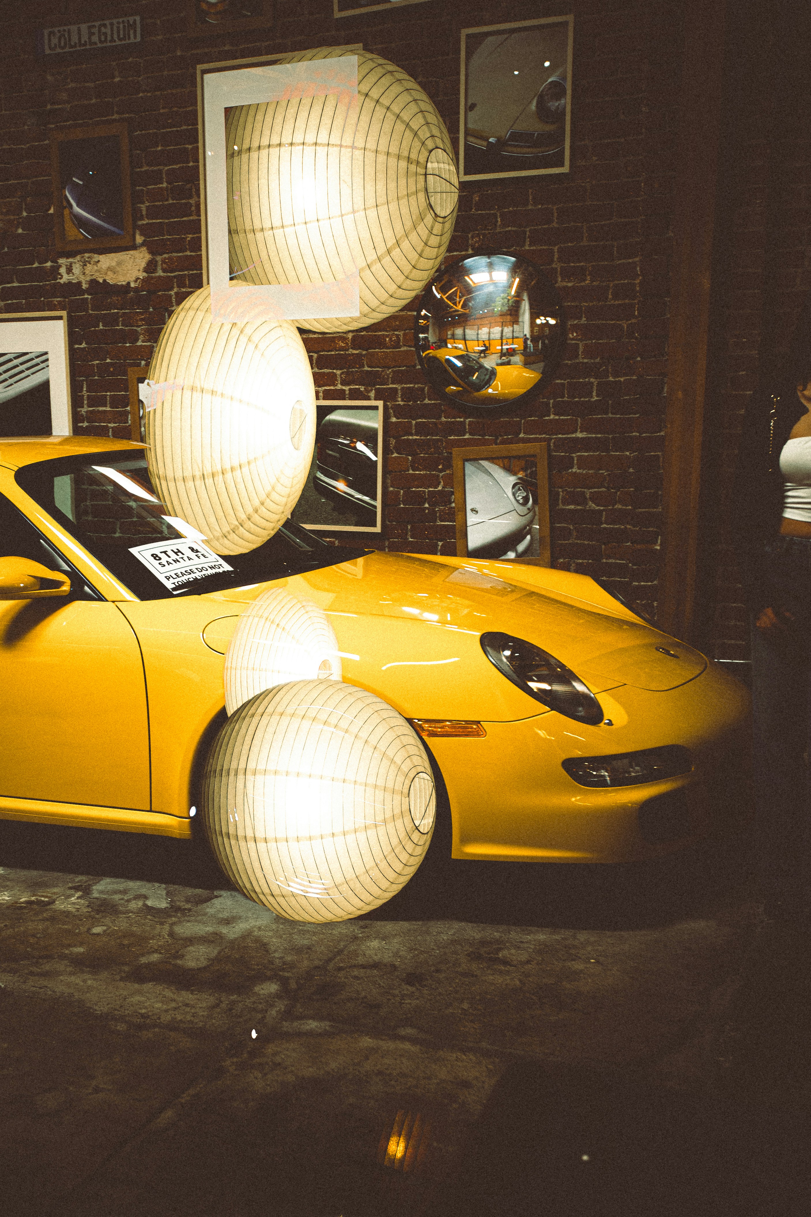 Yellow sports car with decorative lanterns
