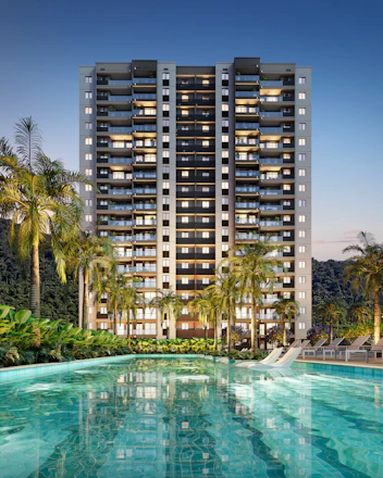 Modern high-rise building with pool and palm trees.