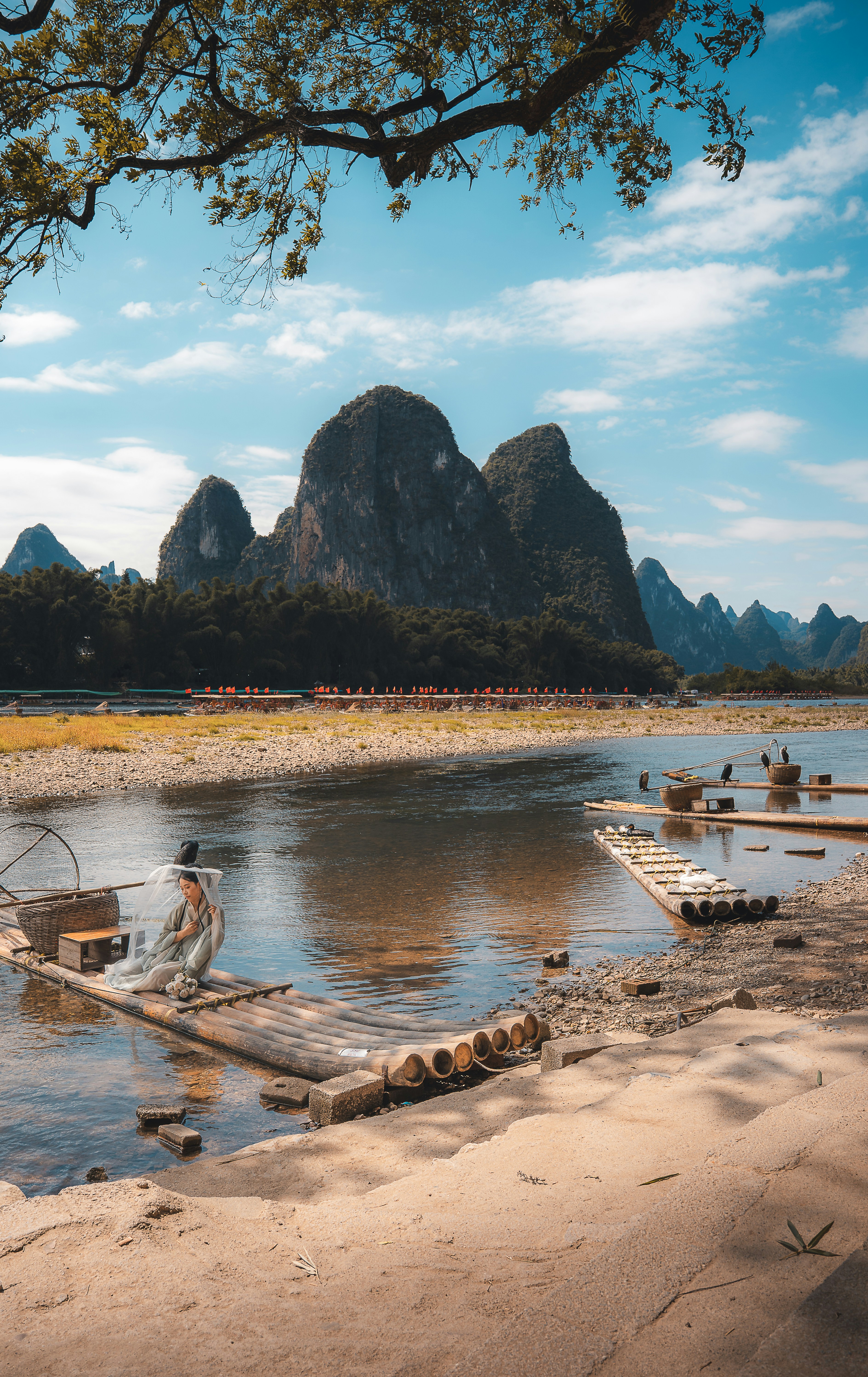 Bamboo raft on river with karst mountains background