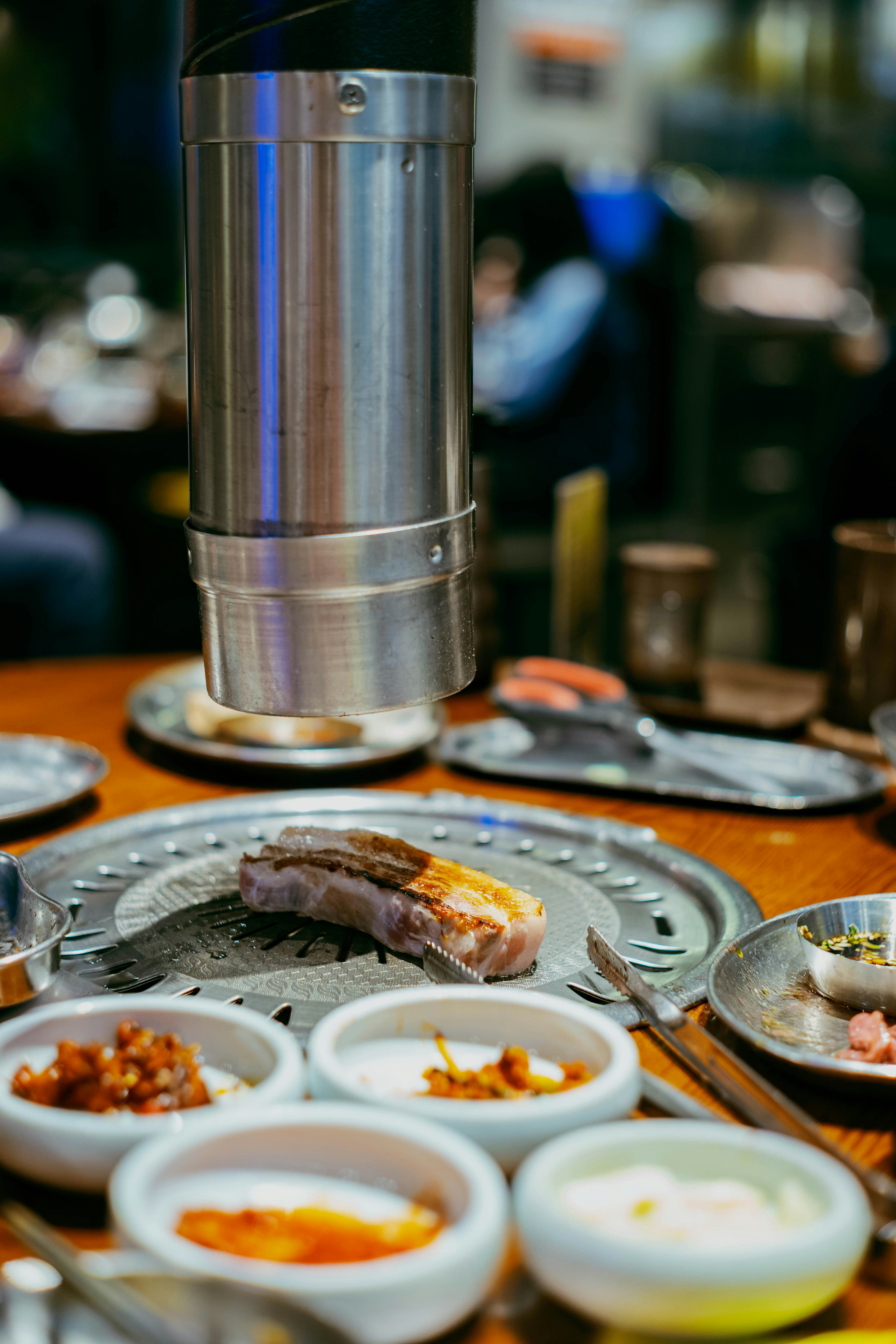 Meat grilling at a korean barbecue restaurant
