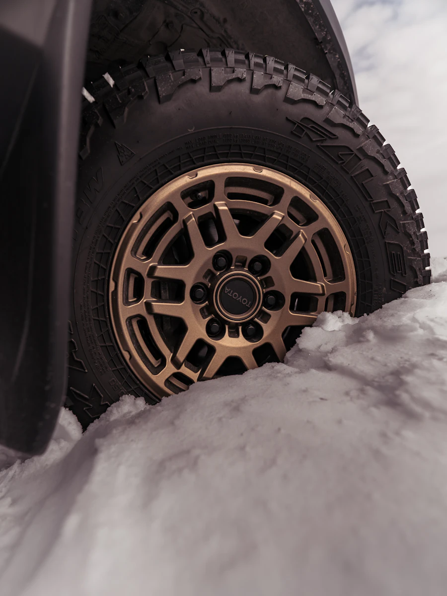 Winter tire and wheel in snow