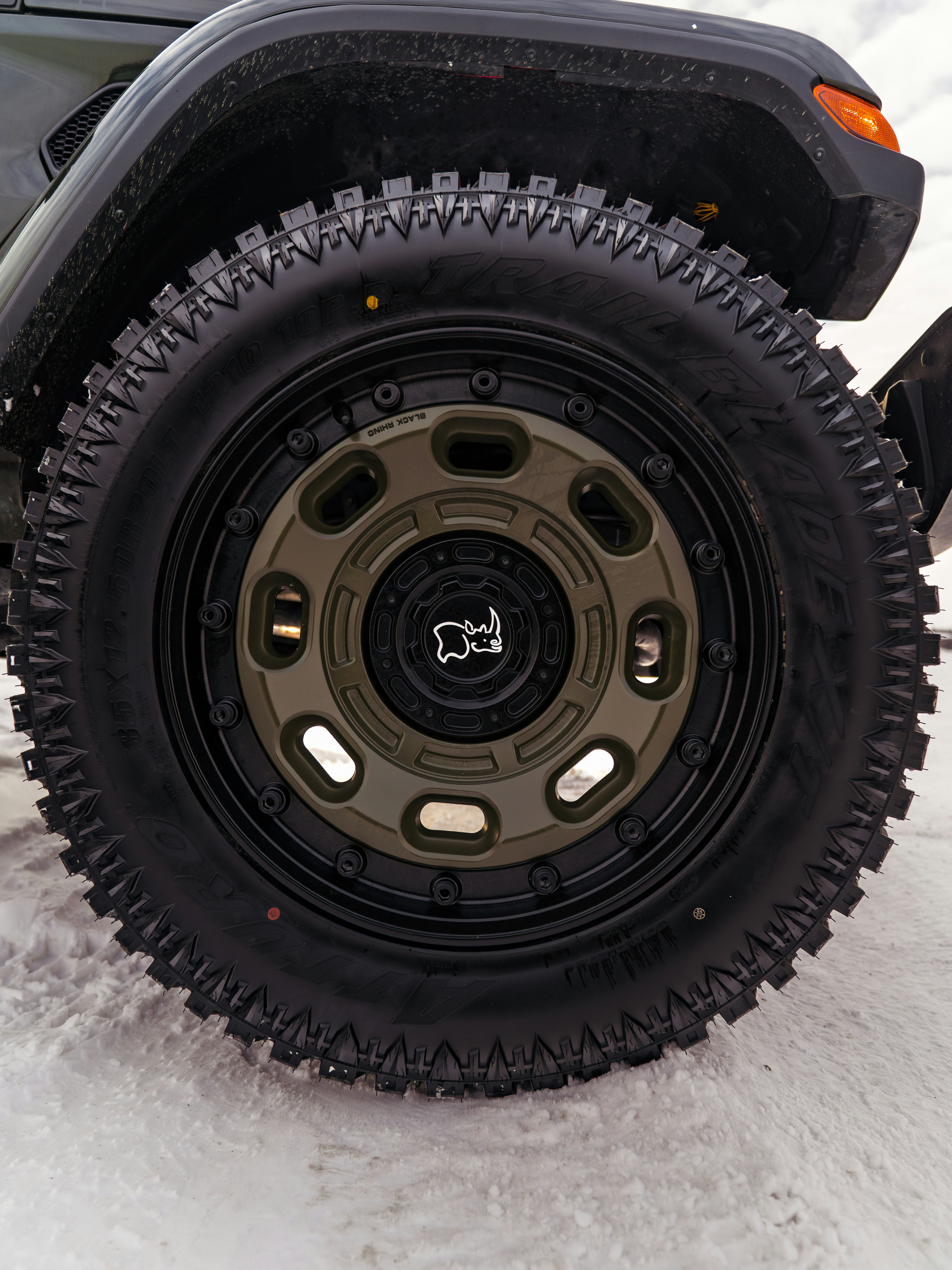 Close-up of a rugged off-road tire and wheel