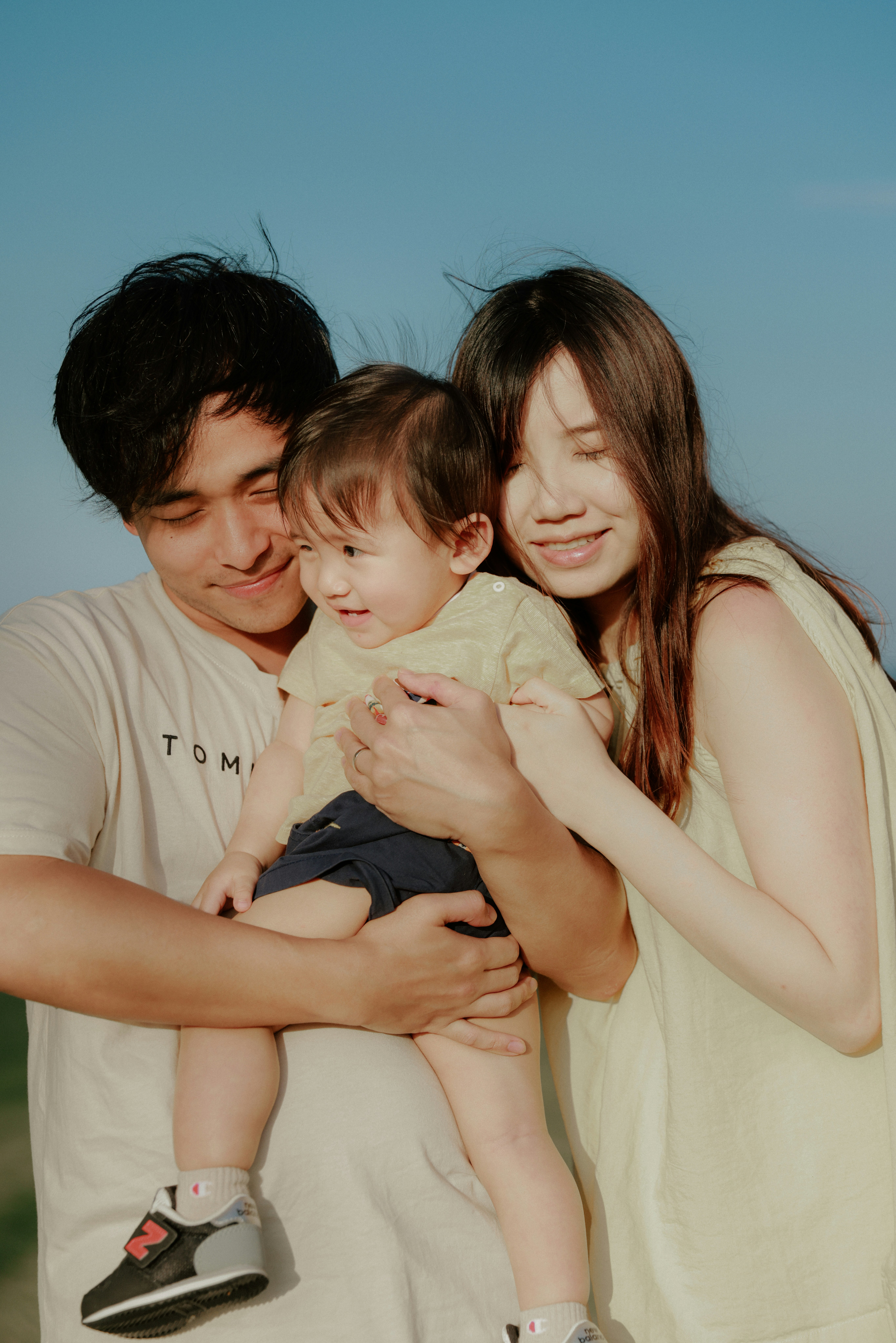 A happy family with a baby outdoors