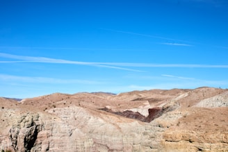 Arid desert landscape under a clear blue sky.