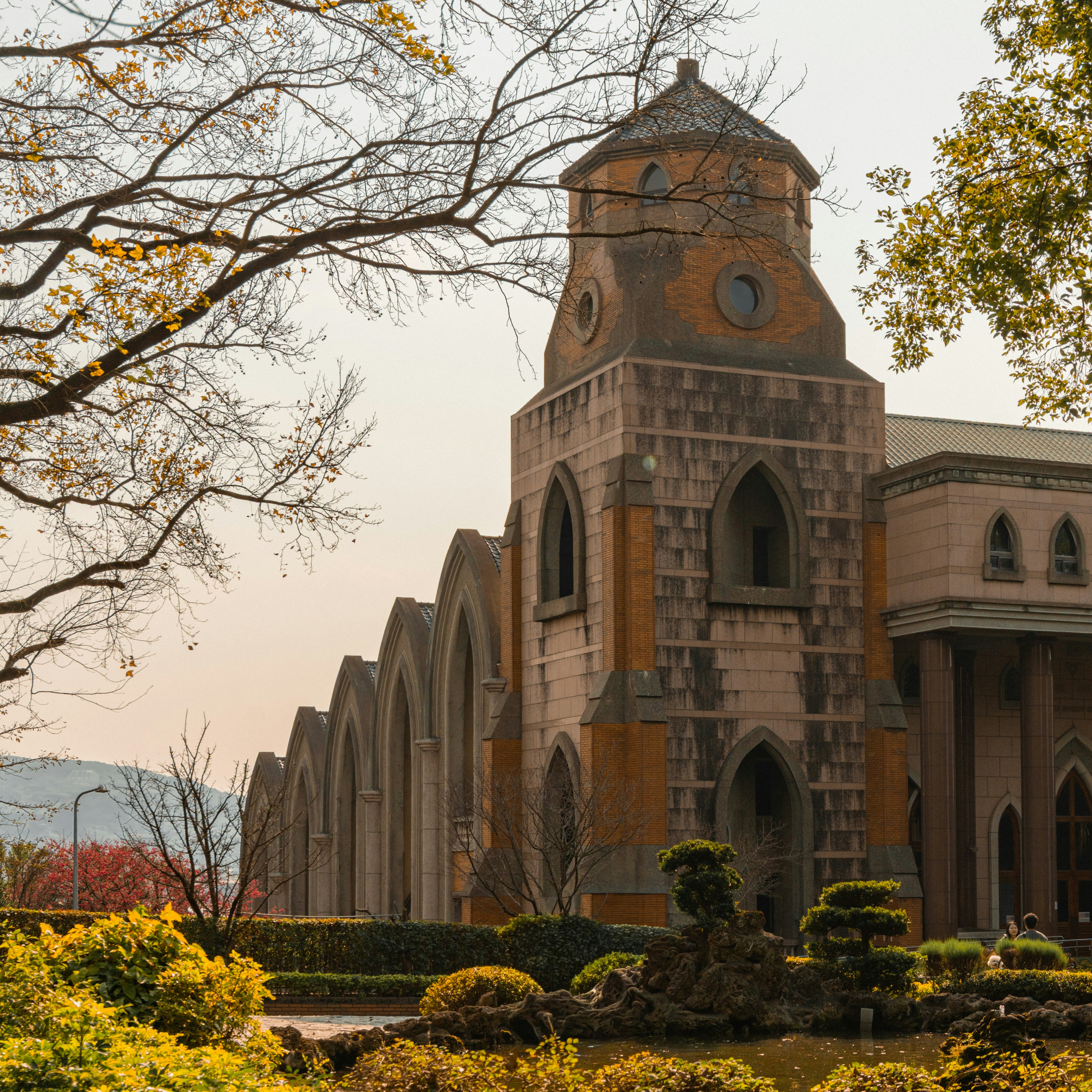 Historic church with arched windows and a bell tower.