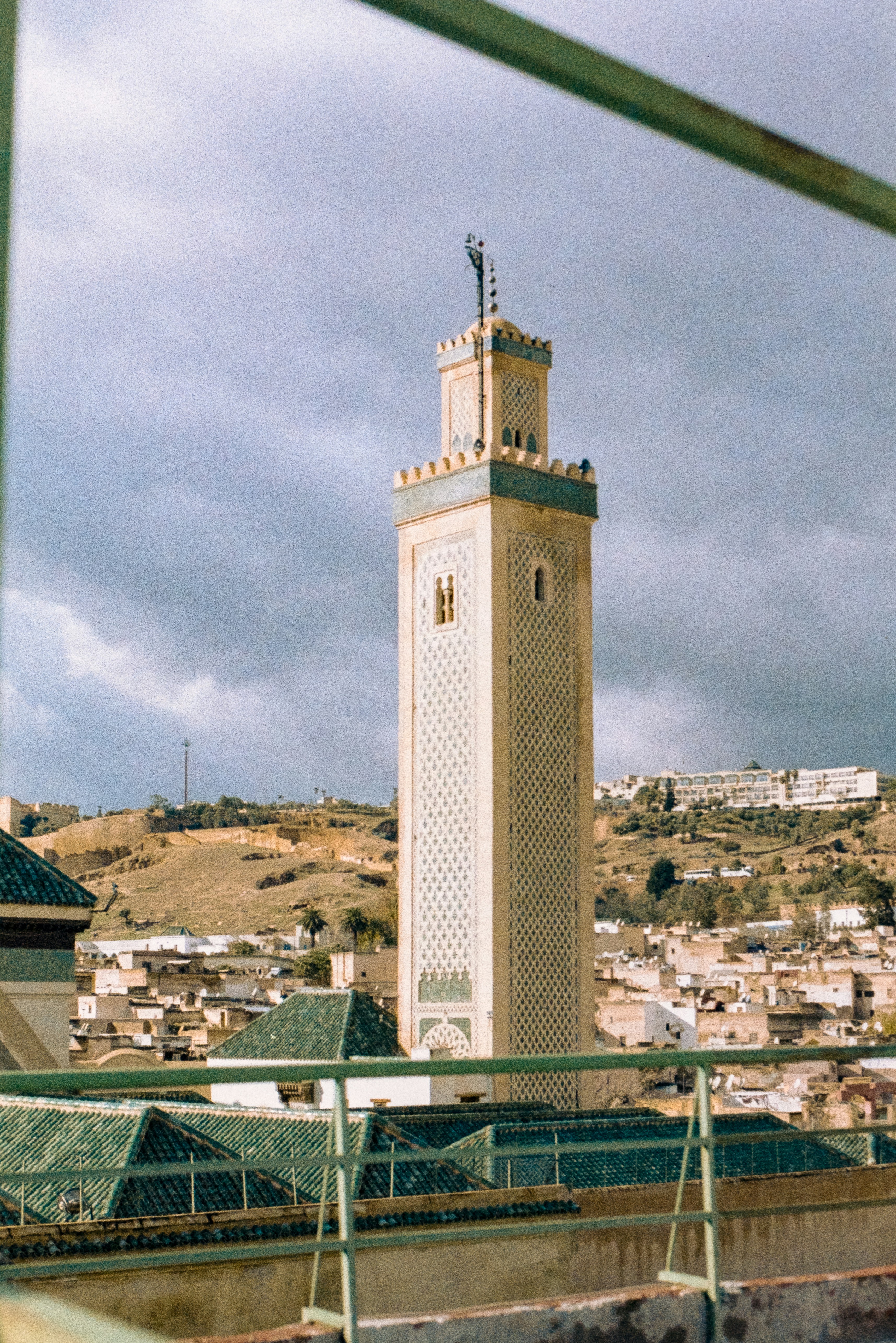Tall minaret tower above a moroccan city