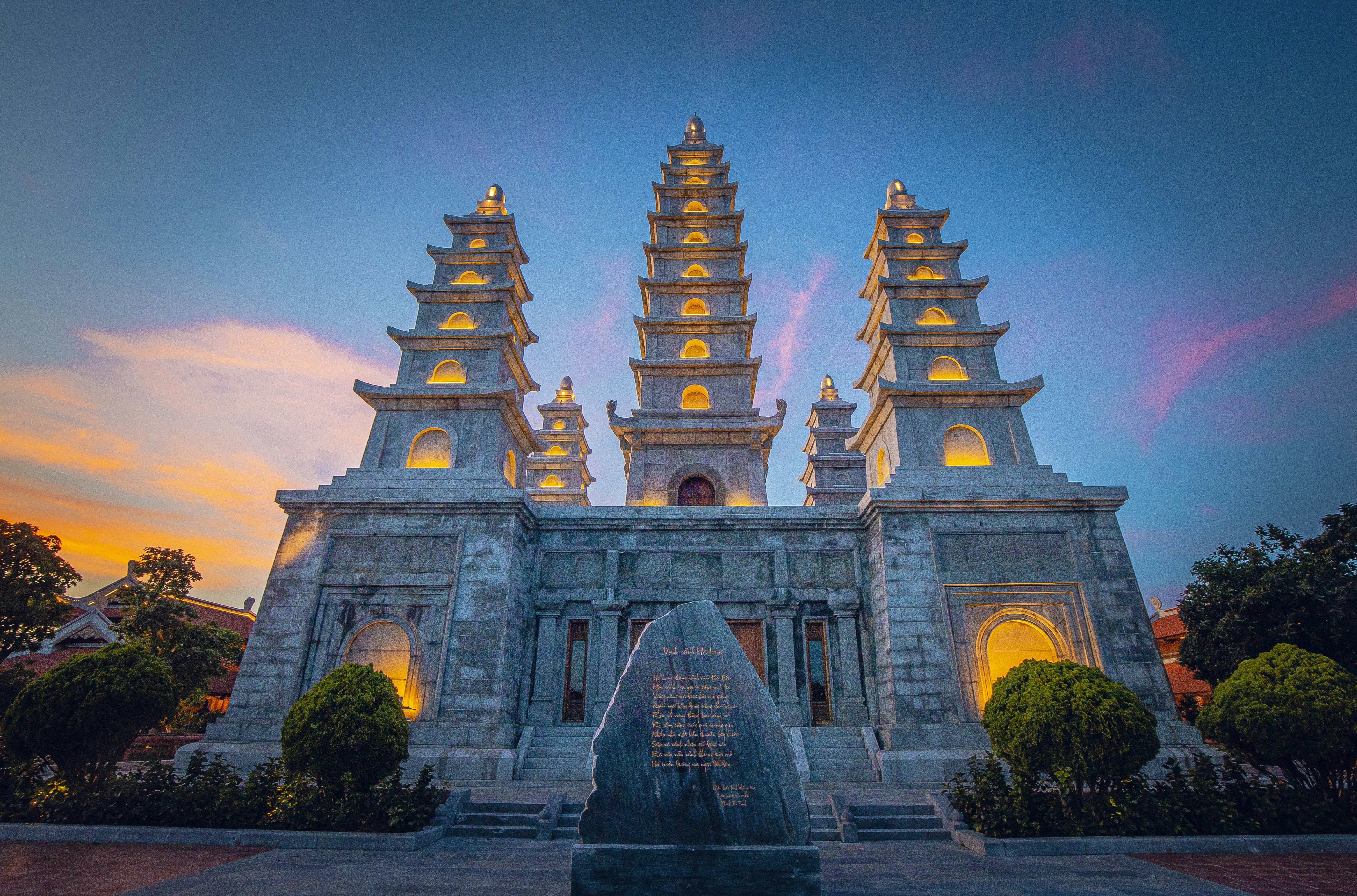 Ornate temple with tall spires at sunset