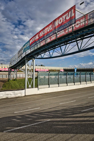 Race track with advertising banners under a cloudy sky