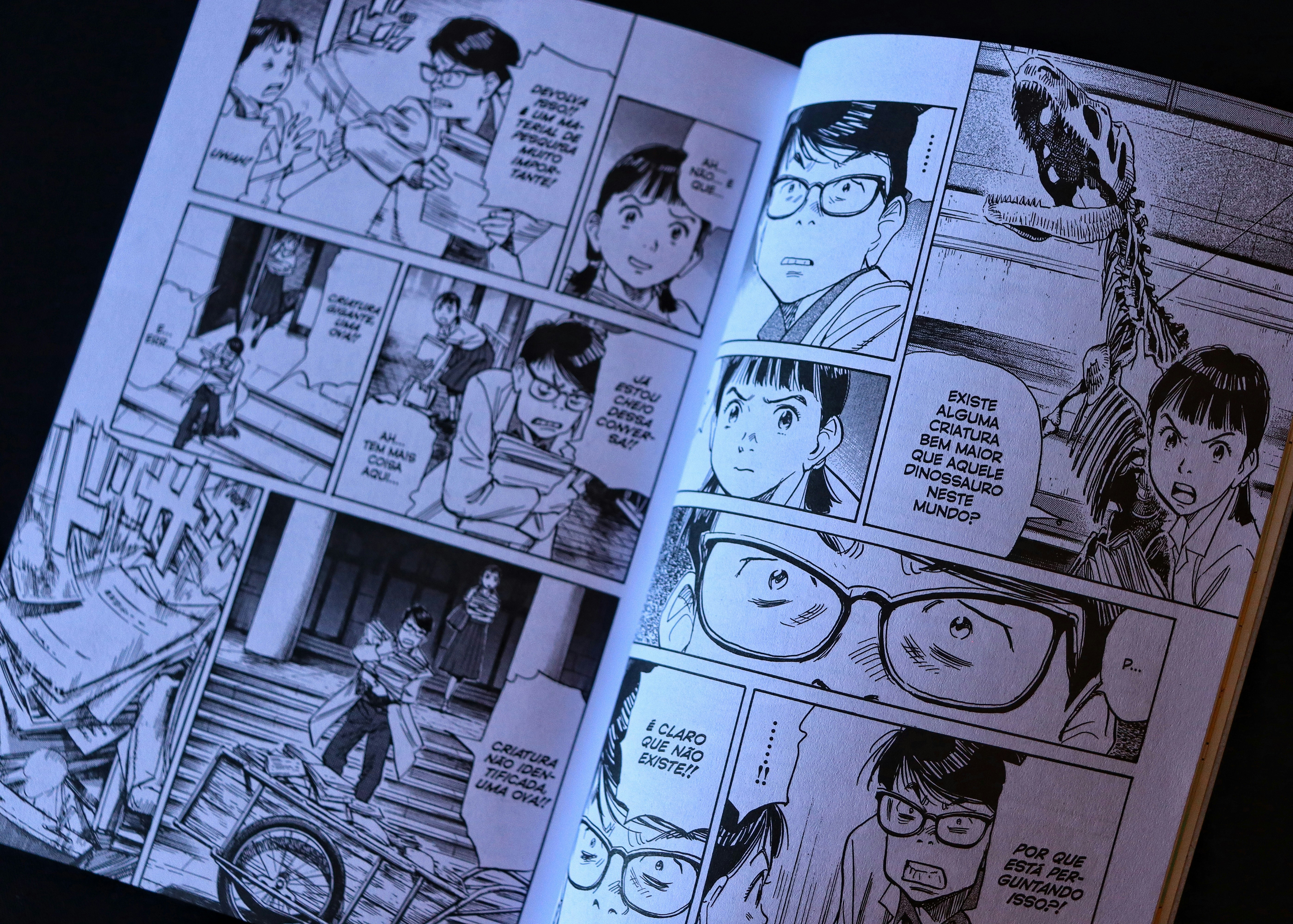 Open comic book with panels and dialogue bubbles