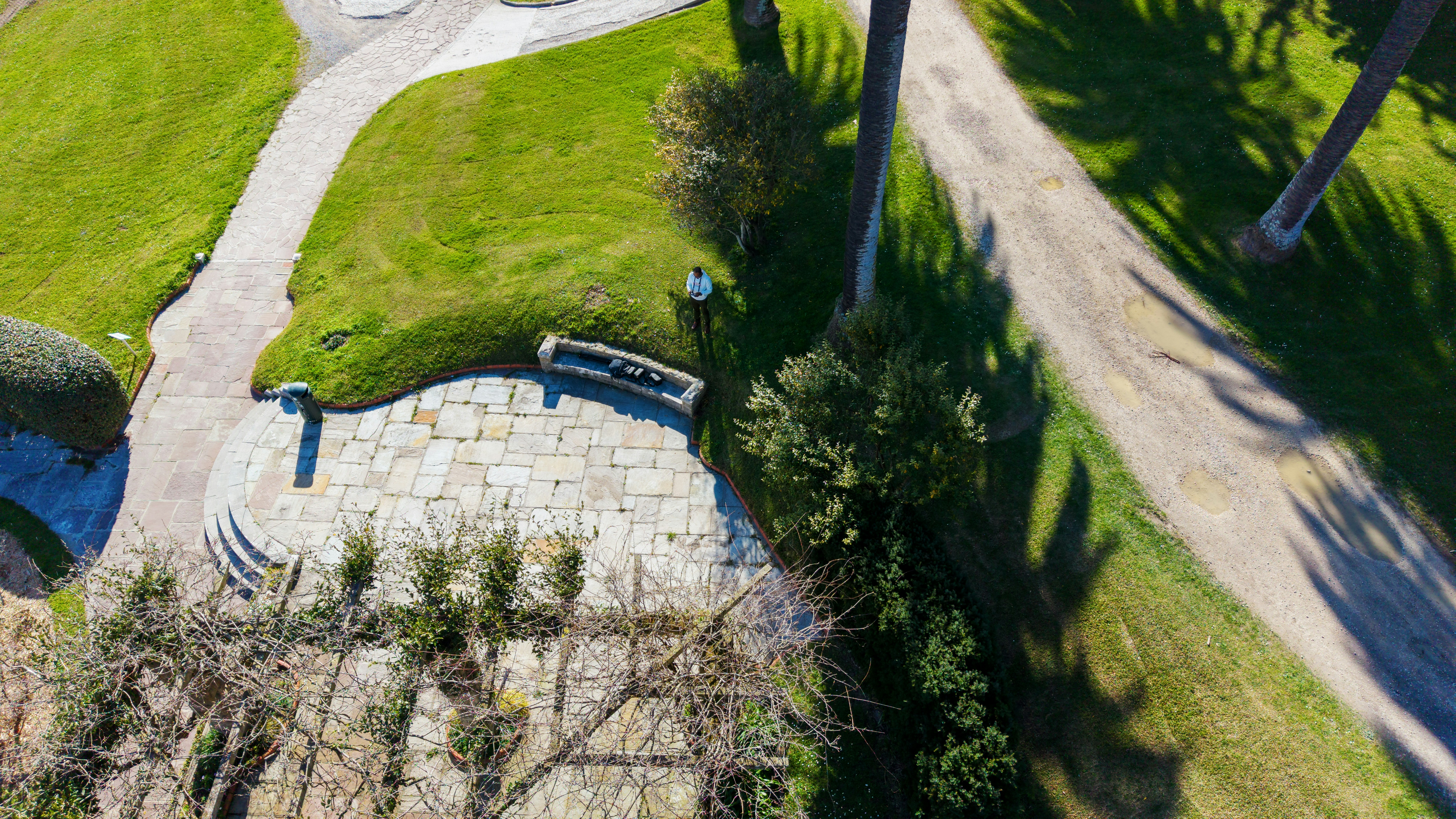 Aerial view of a park with stone patio and pathway