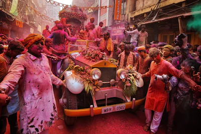 People celebrate holi festival with colored powders.