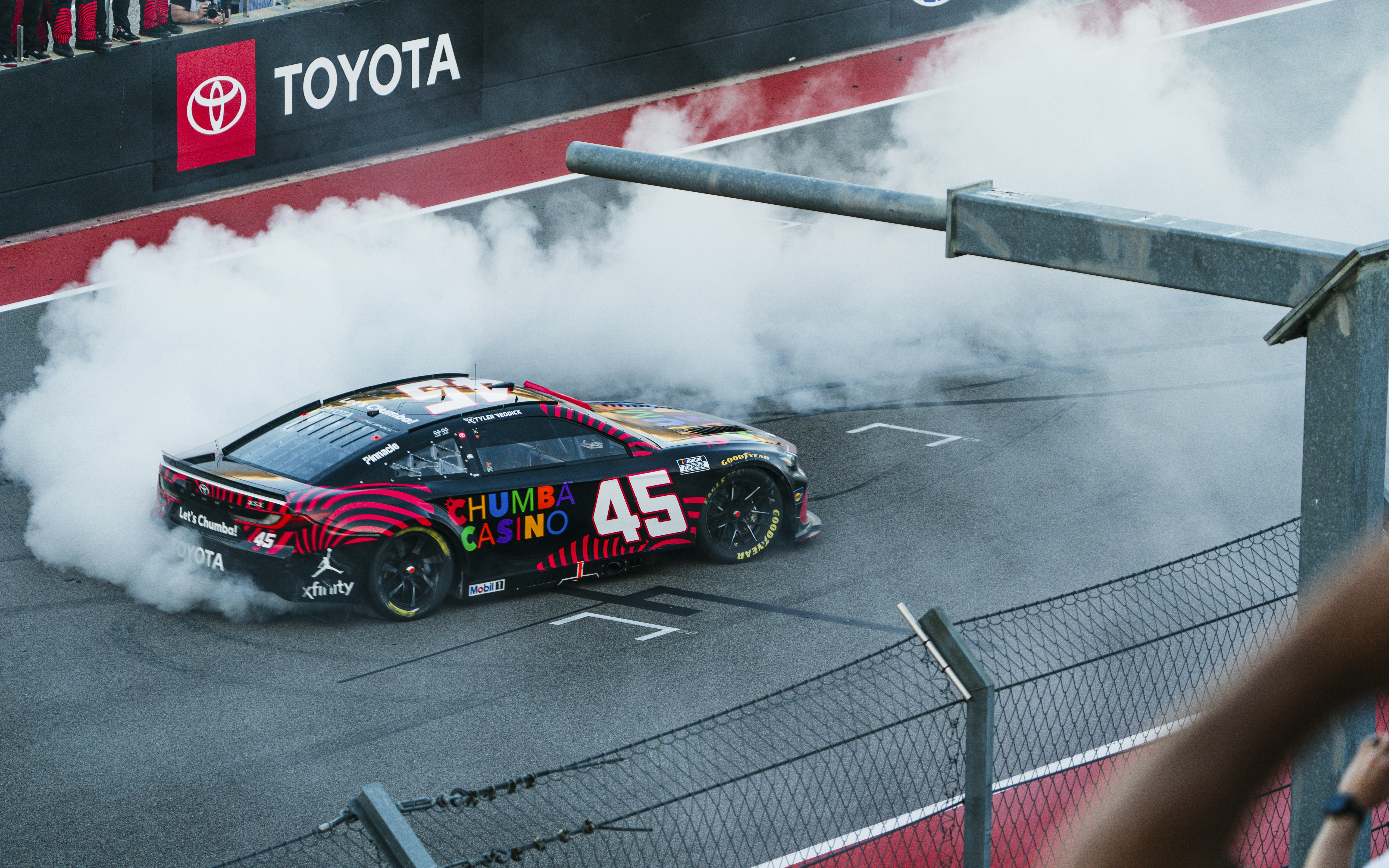 Race car doing a burnout in smoke