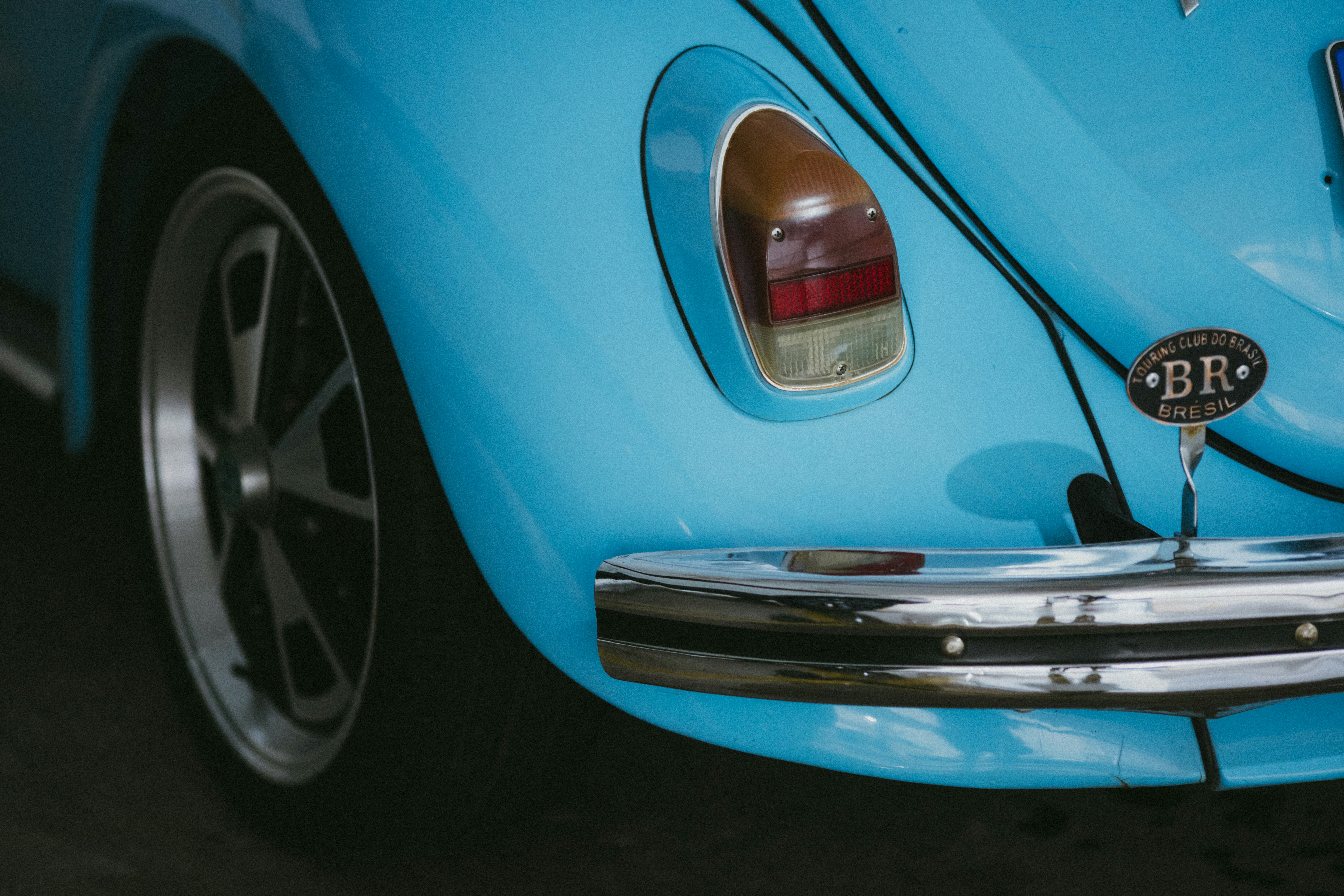 Close-up of a vintage blue volkswagen beetle's rear