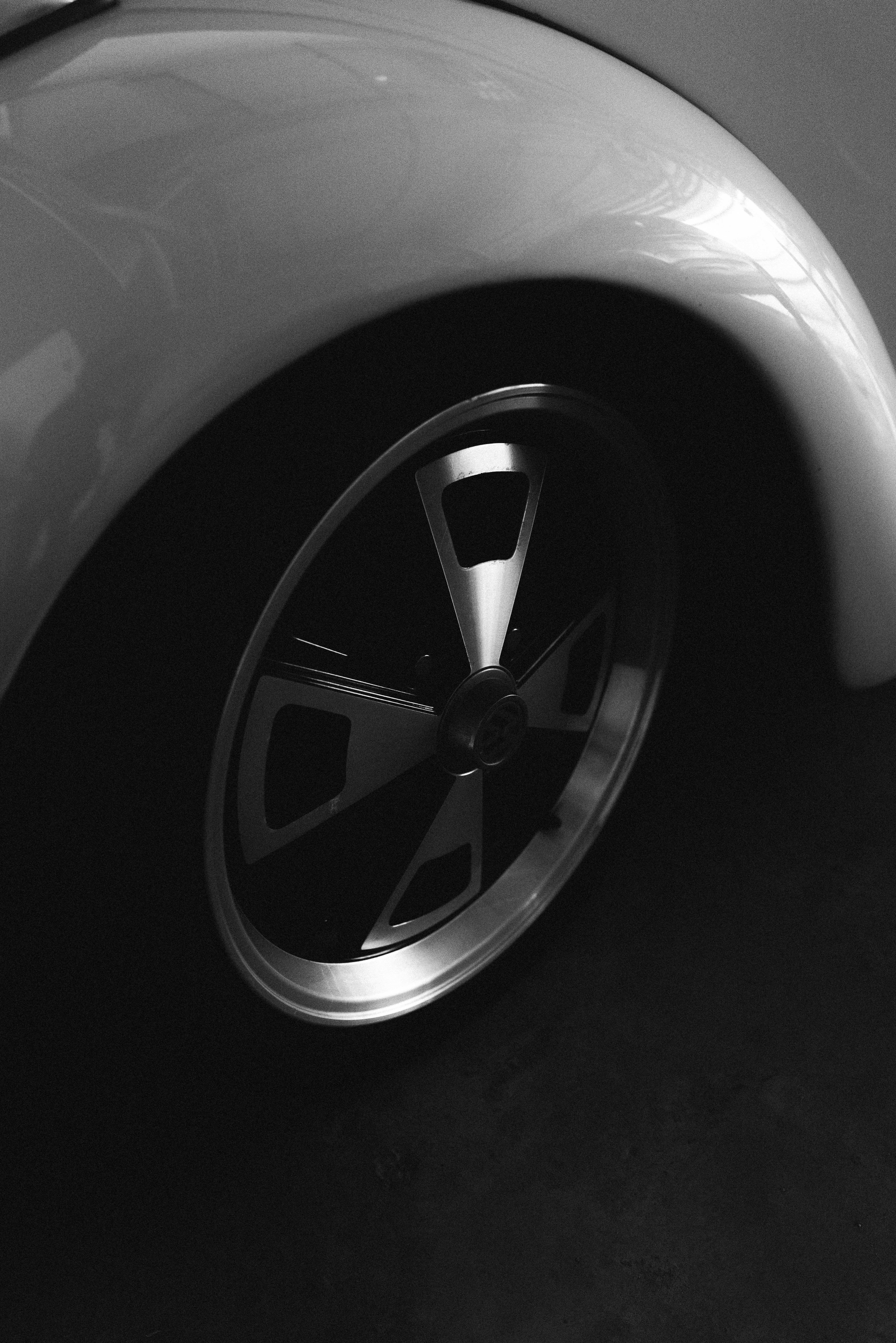 Close-up of a vintage car wheel and fender