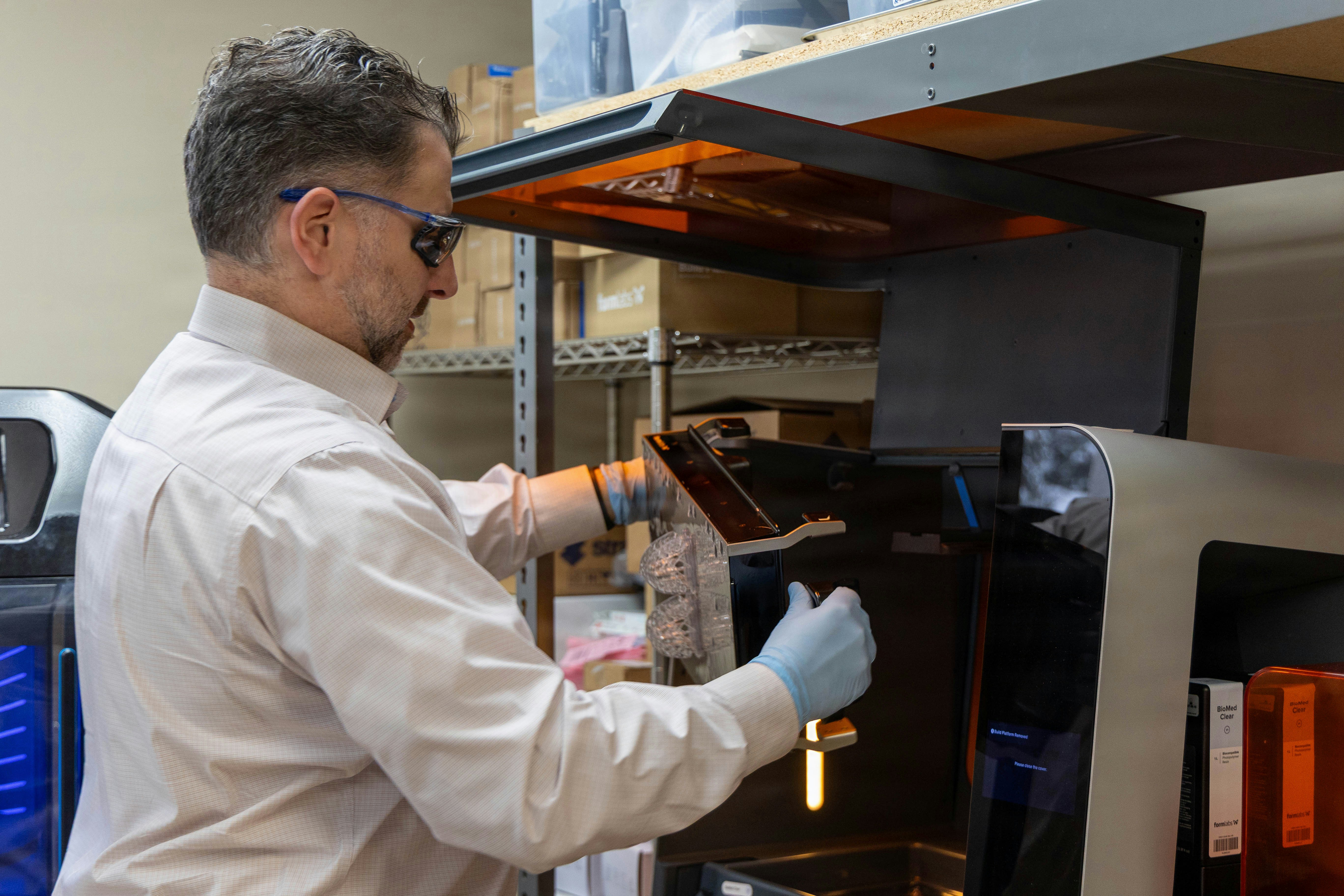 Man in gloves operating a 3D printer photo - Free Technology Image on ...