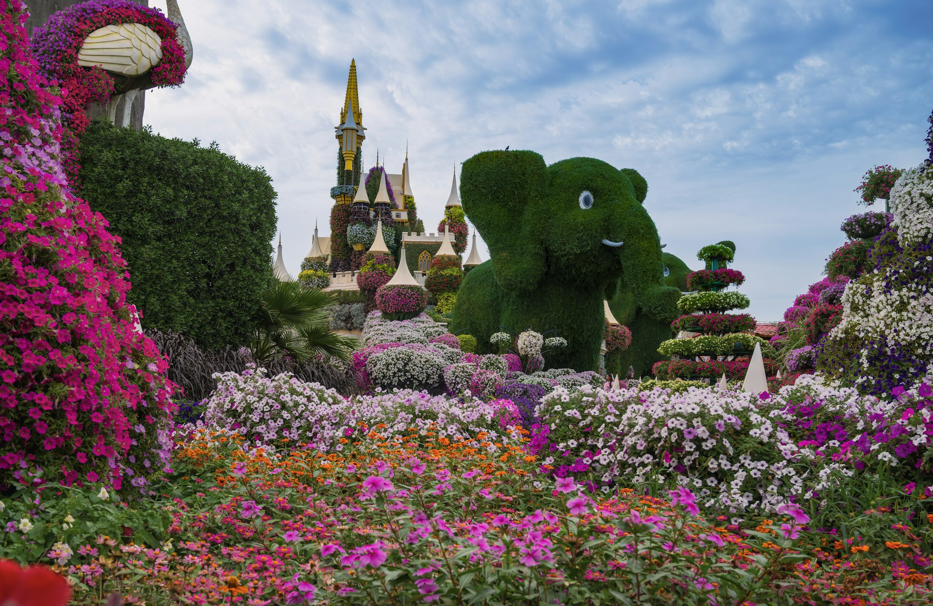 A lush garden with floral elephant and castle