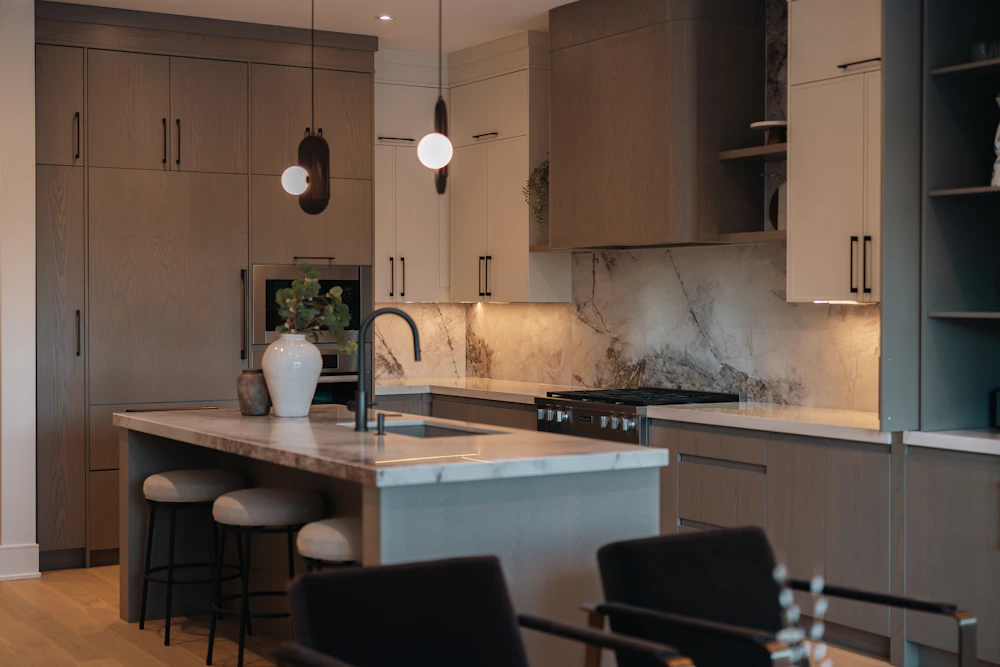 Warm modern kitchen with updated cabinets, countertops and lighting