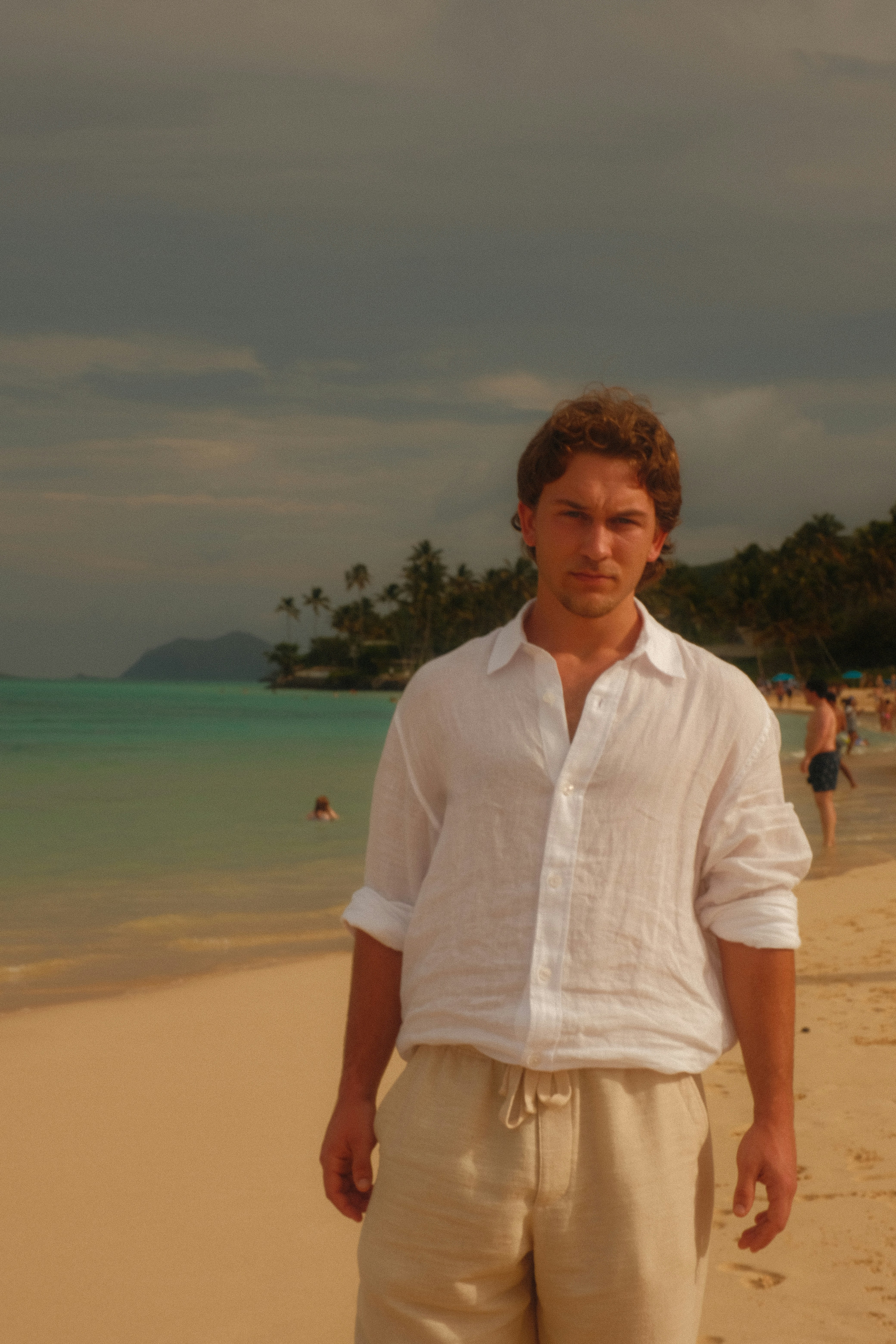 Man in white shirt on a tropical beach