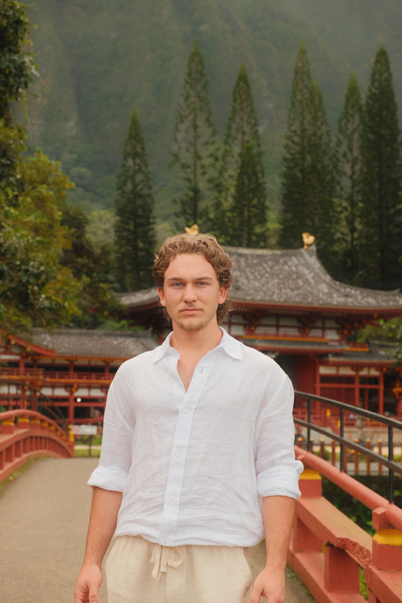 Man standing in front of a japanese temple