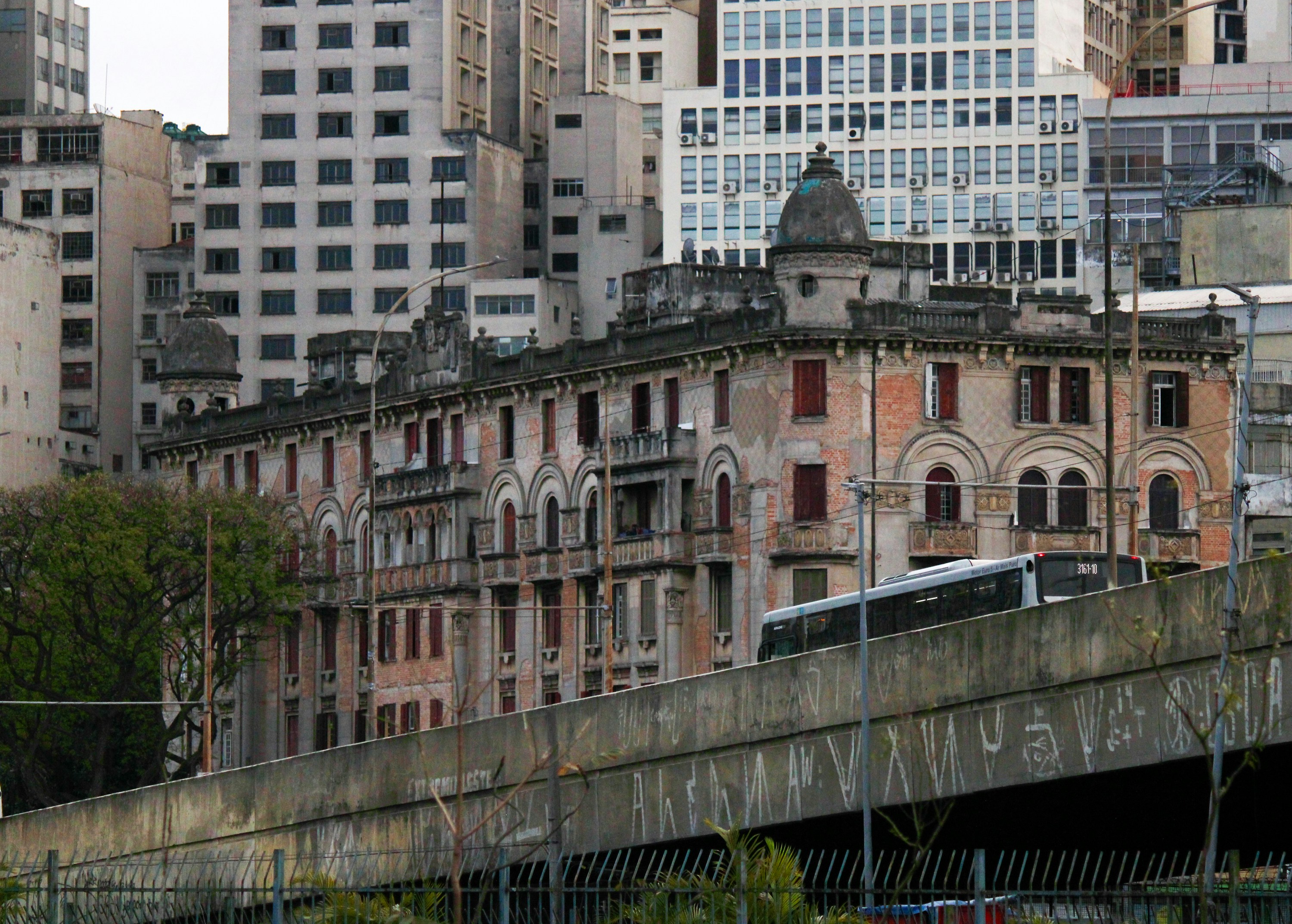 Old building with modern skyscrapers in background