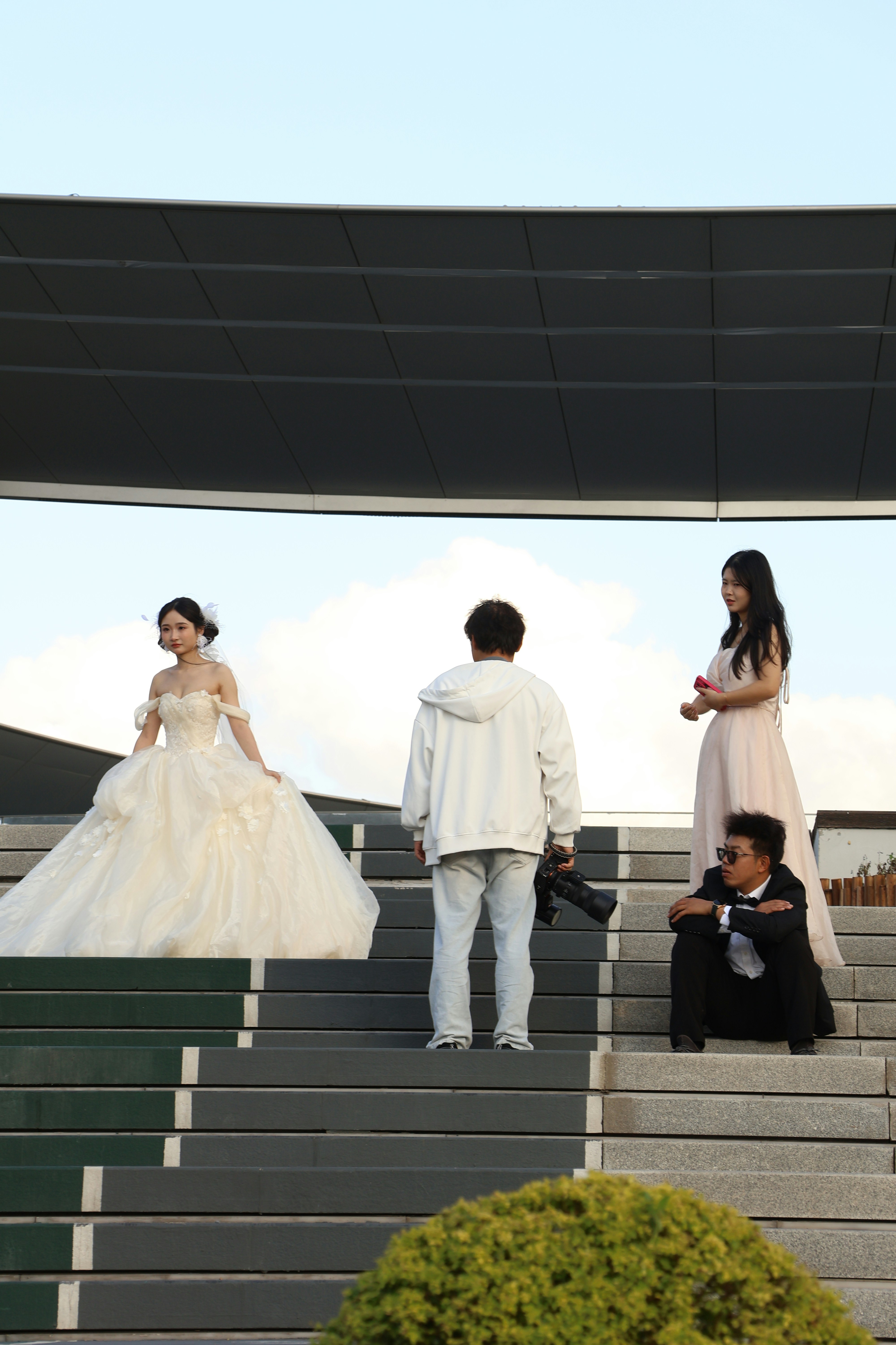 People posing for a photoshoot on outdoor stairs