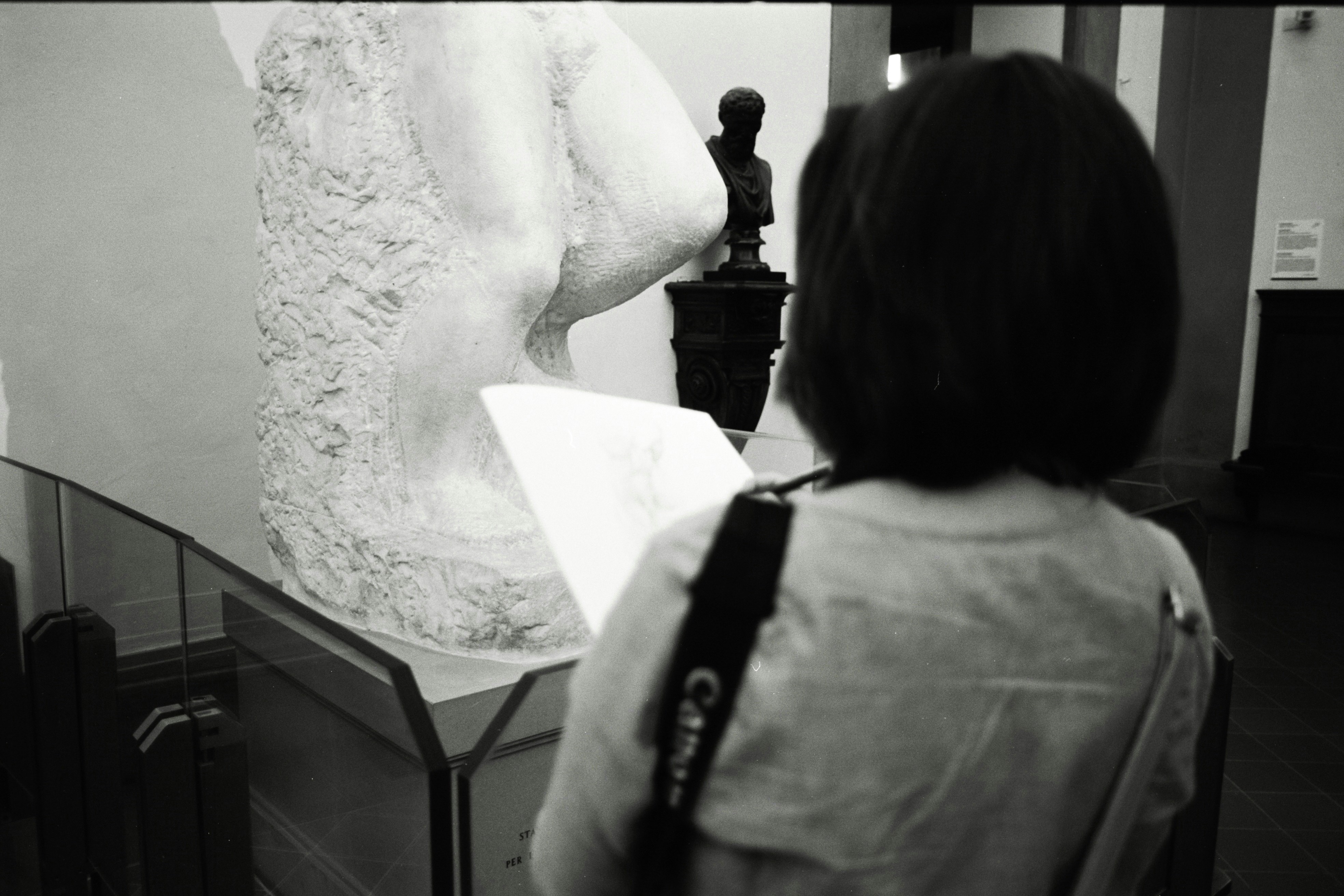 Woman looking at a sculpture in a museum
