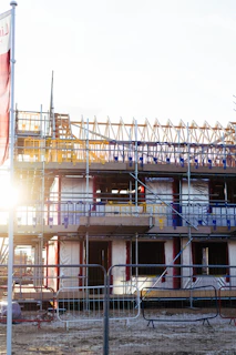 Building construction with scaffolding and materials.