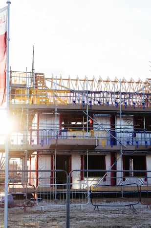 Building construction with scaffolding and materials.