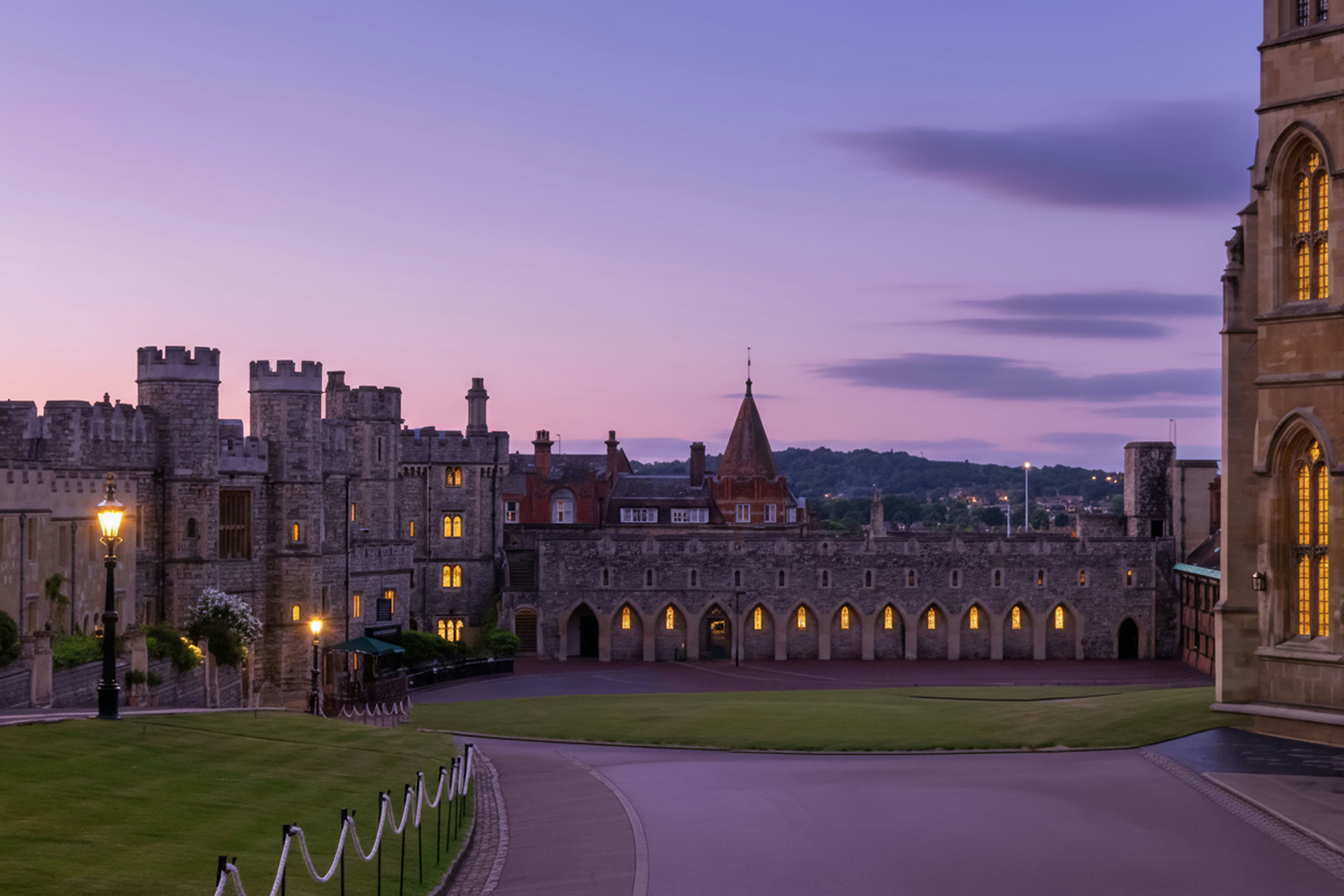 Castle courtyard at dusk with purple sky