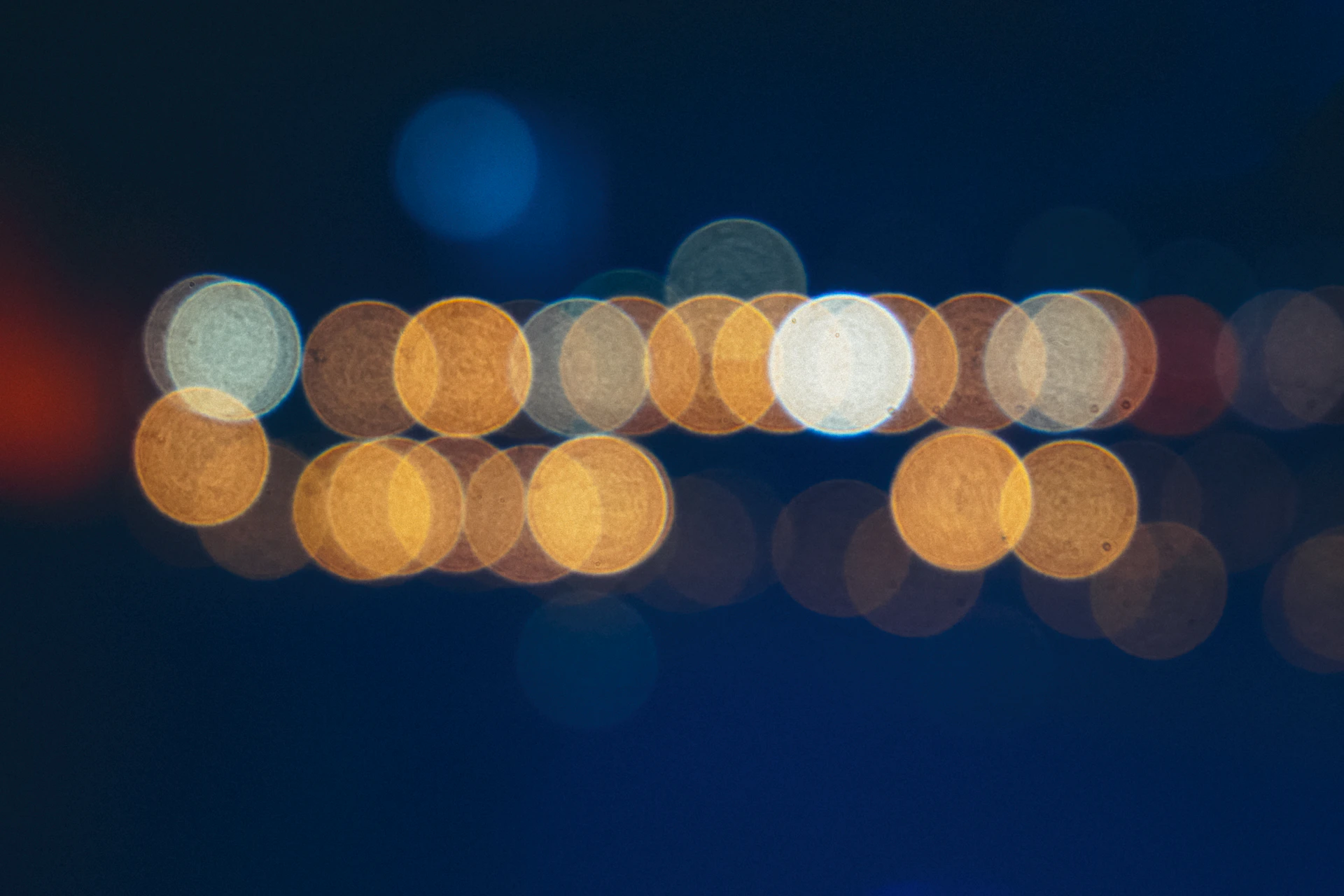 Blurred city lights at night on dark background