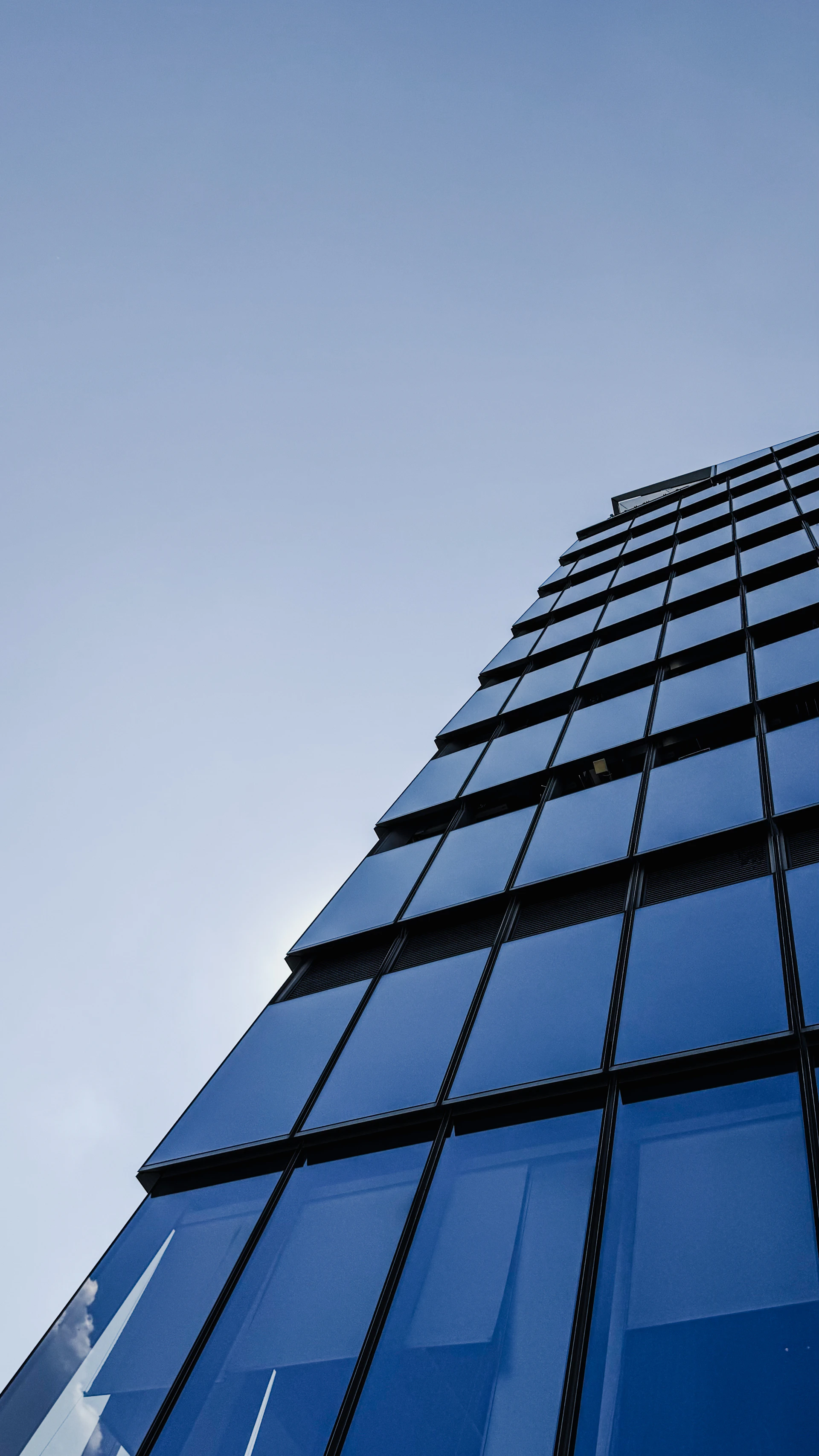 Modern building facade with blue glass panels