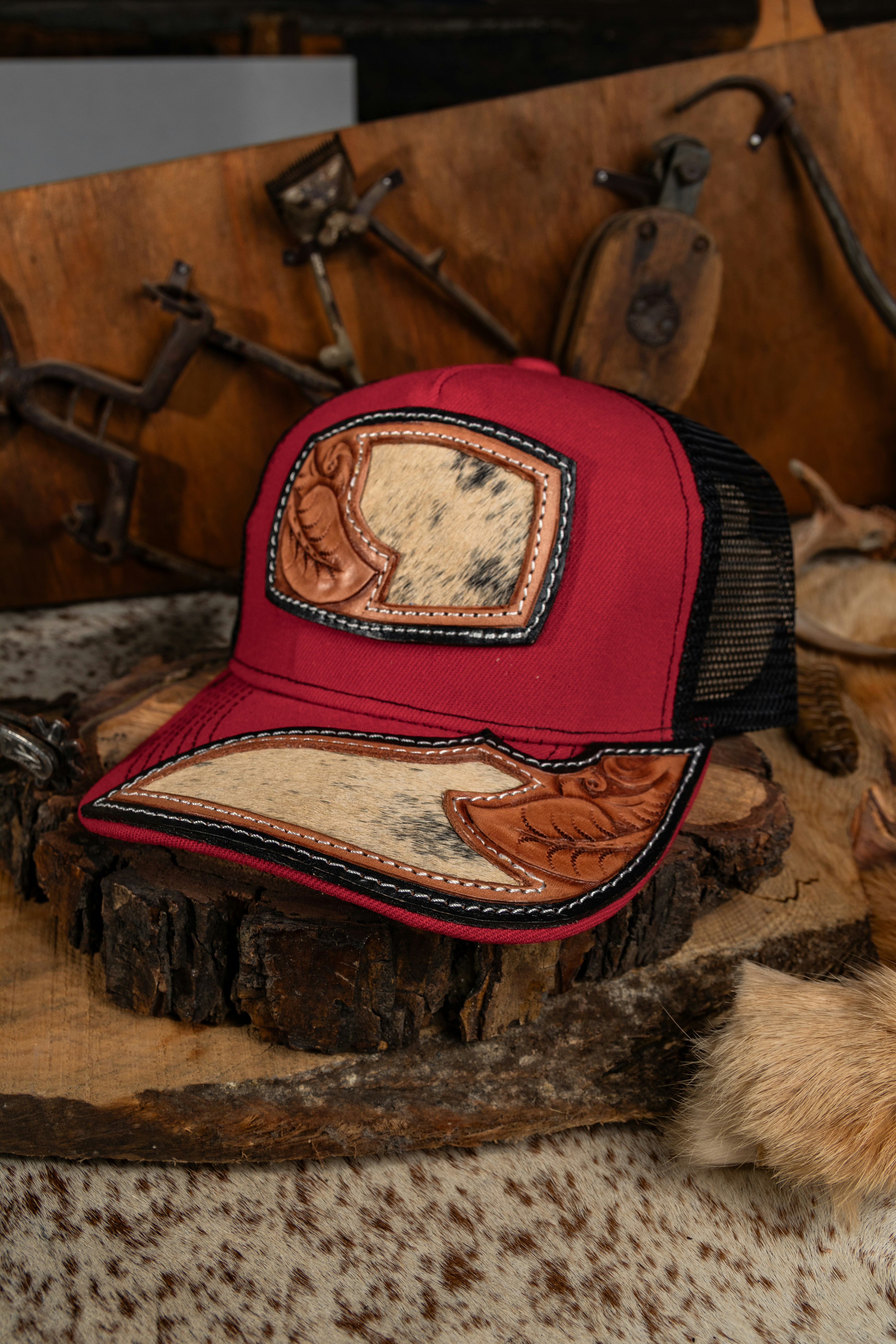 Red baseball cap with leather and cowhide accents