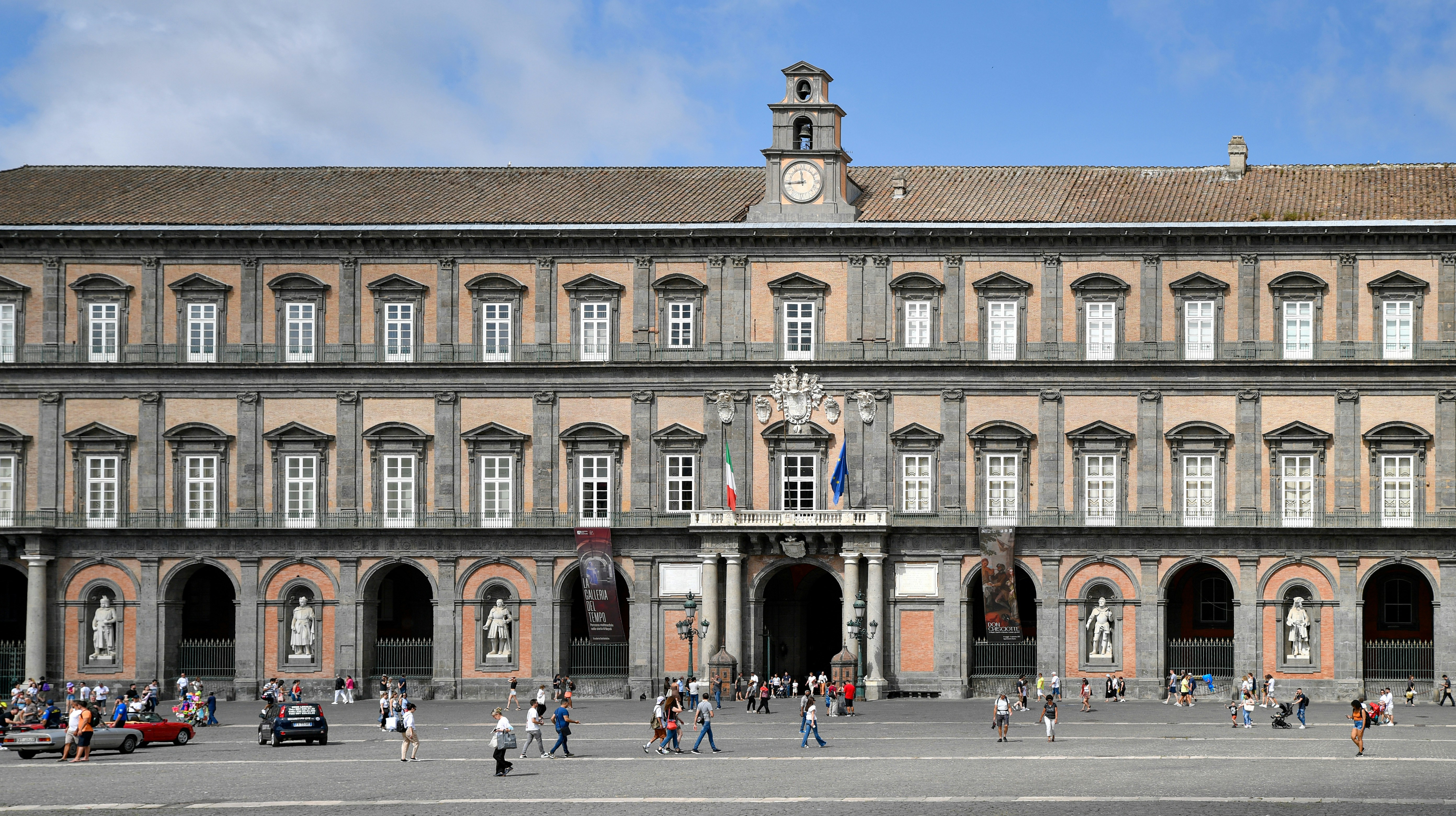 Royal palace of naples building with people in square