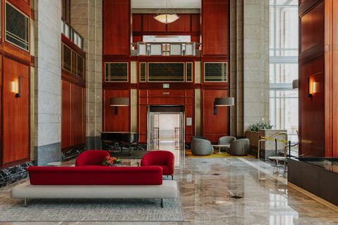 Modern lobby with red sofas and marble floors