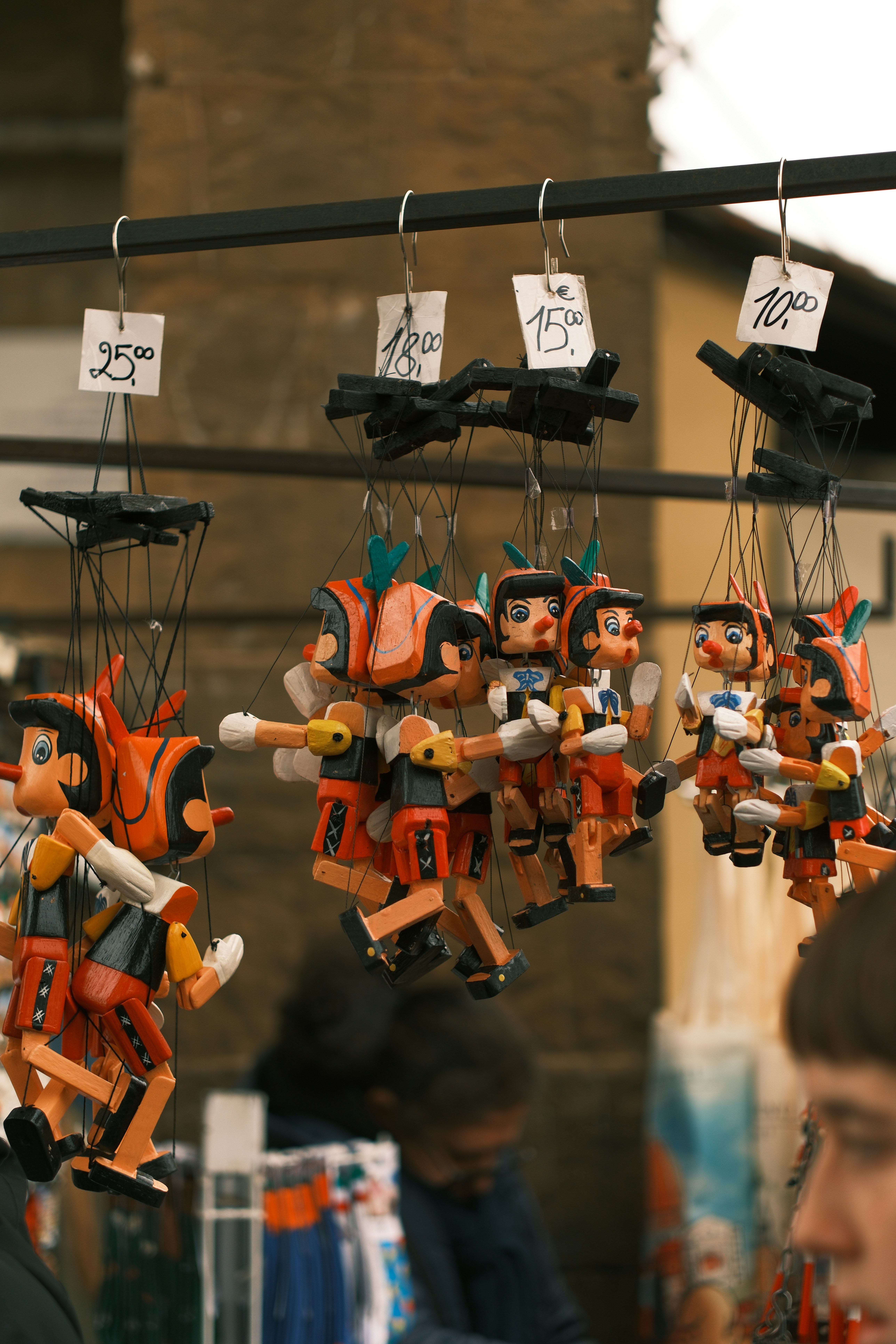 Wooden pinocchio puppets hanging for sale