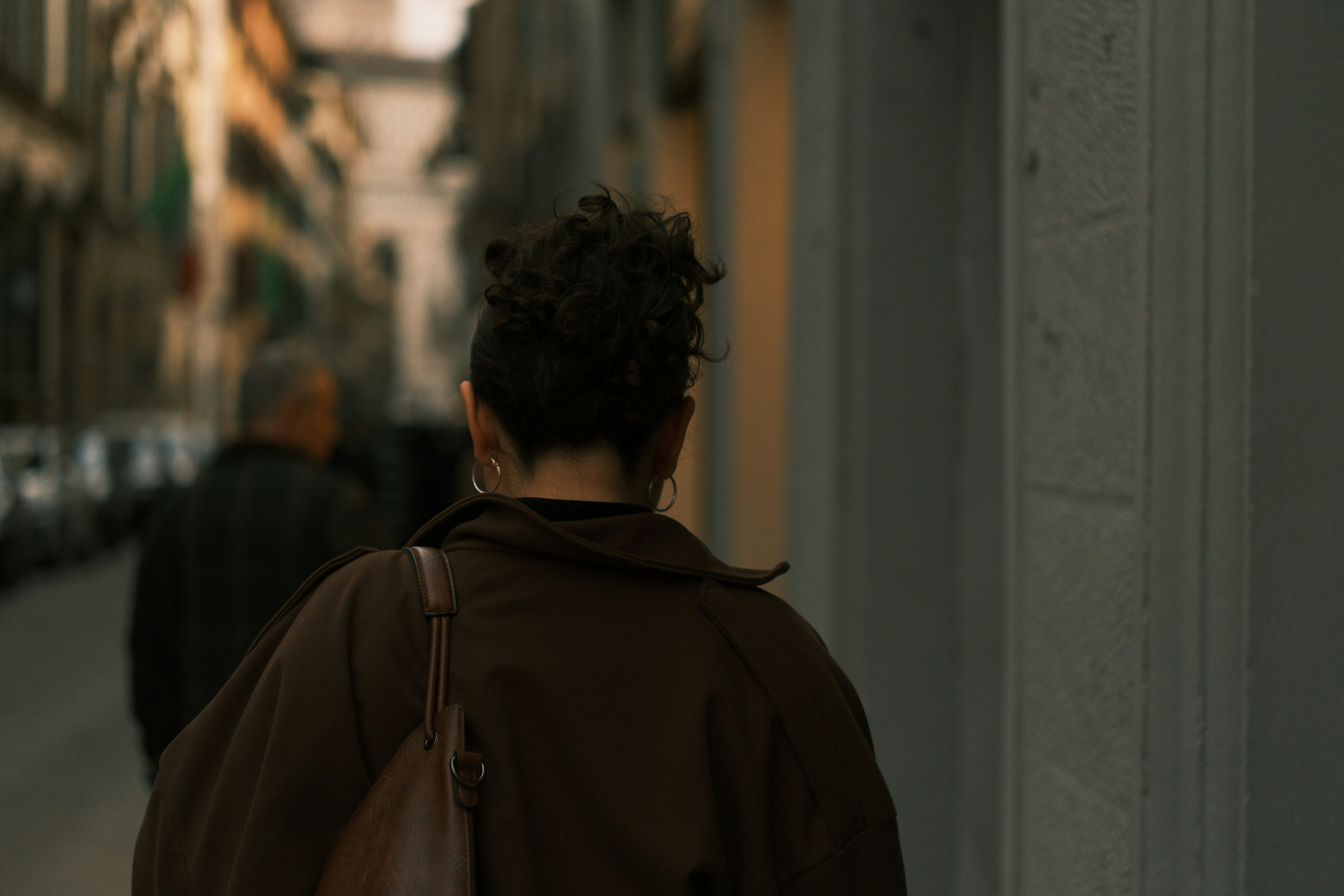 Woman walking down a city street