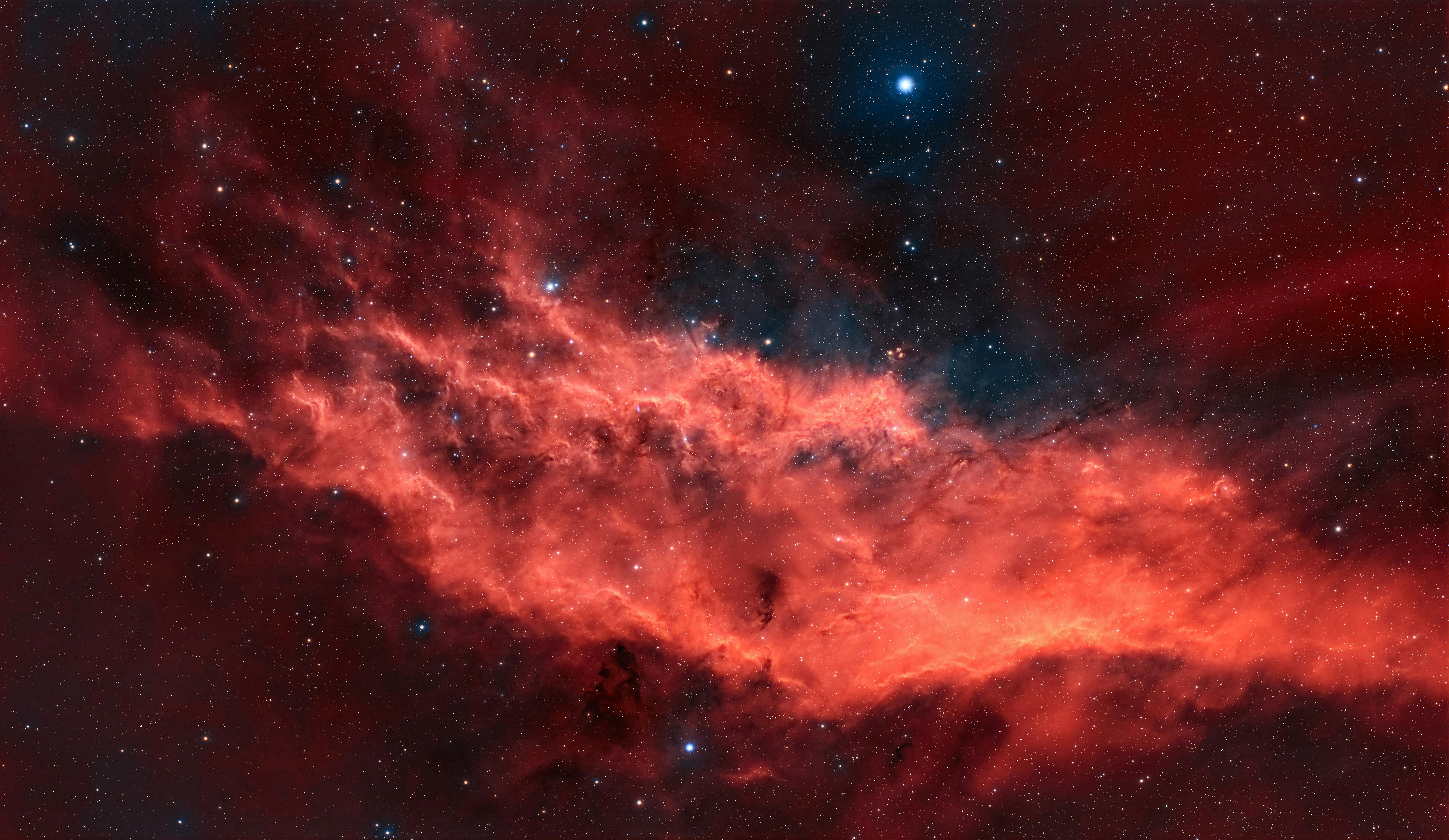 Red nebula and stars in deep space