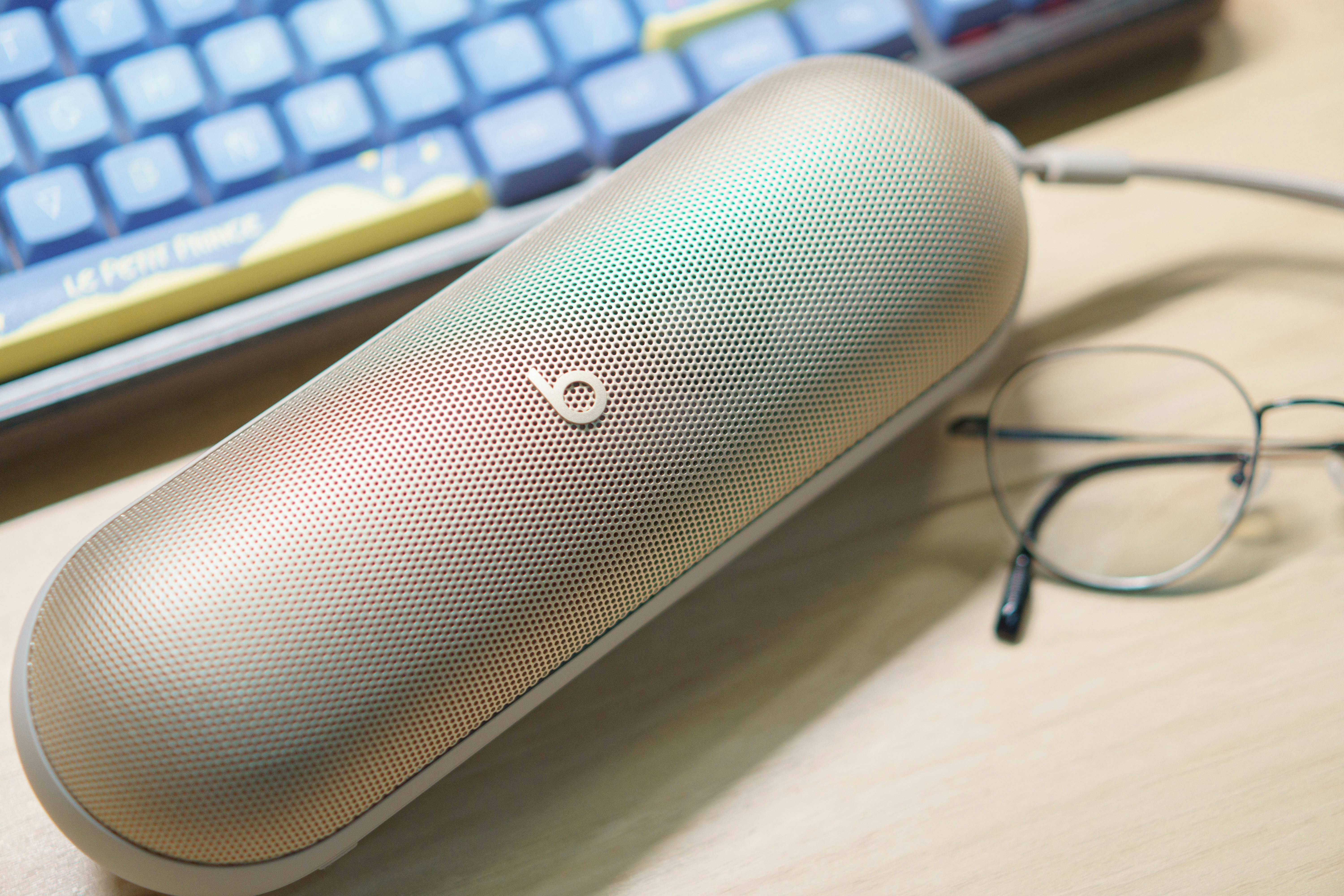 Gold beats case with glasses and keyboard