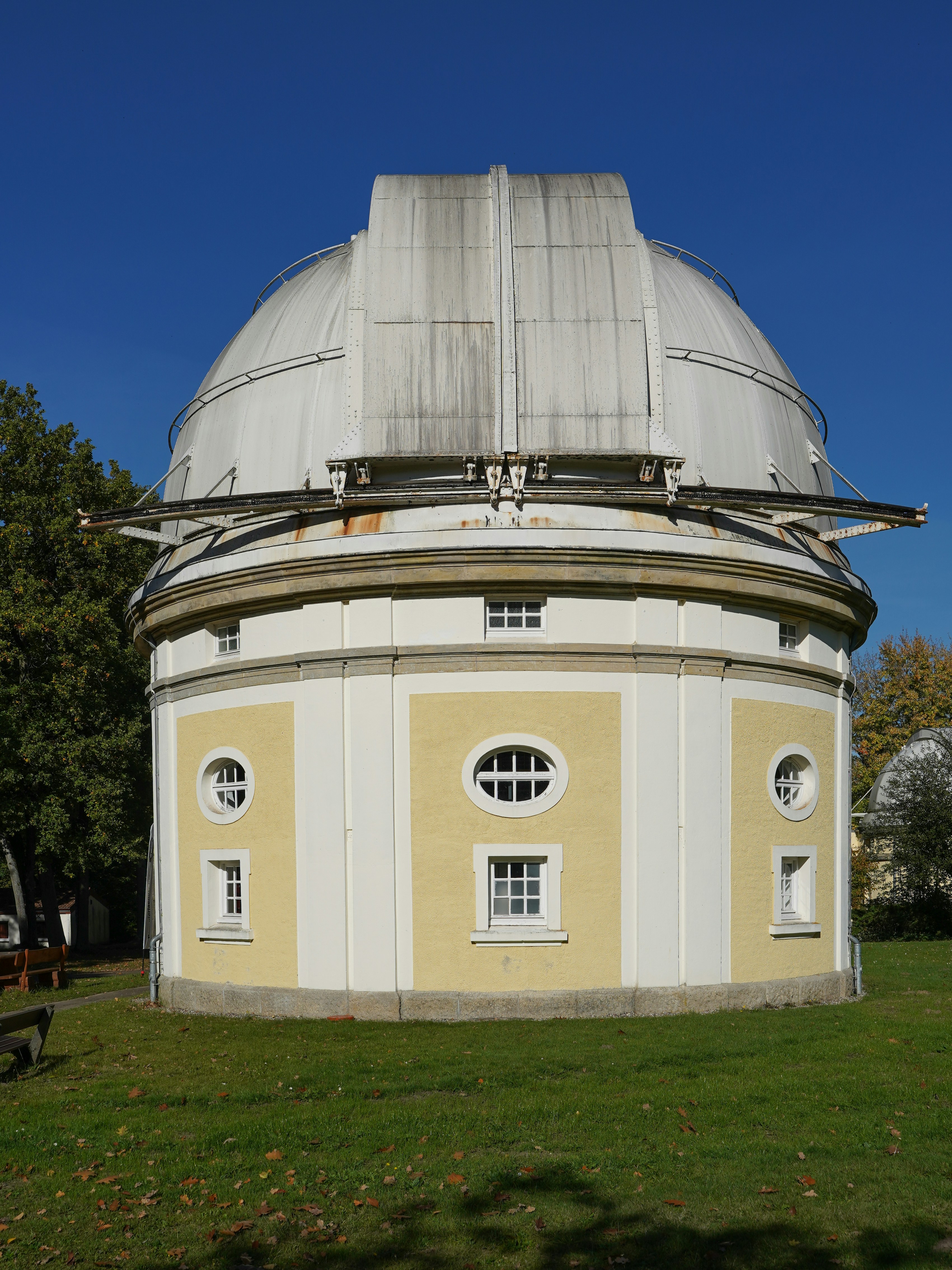 Observatory building with a domed roof under blue sky