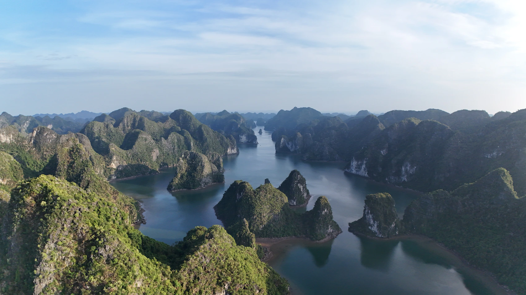 Limestone islands rising from the water of Hạ Long Bay in Vietnam