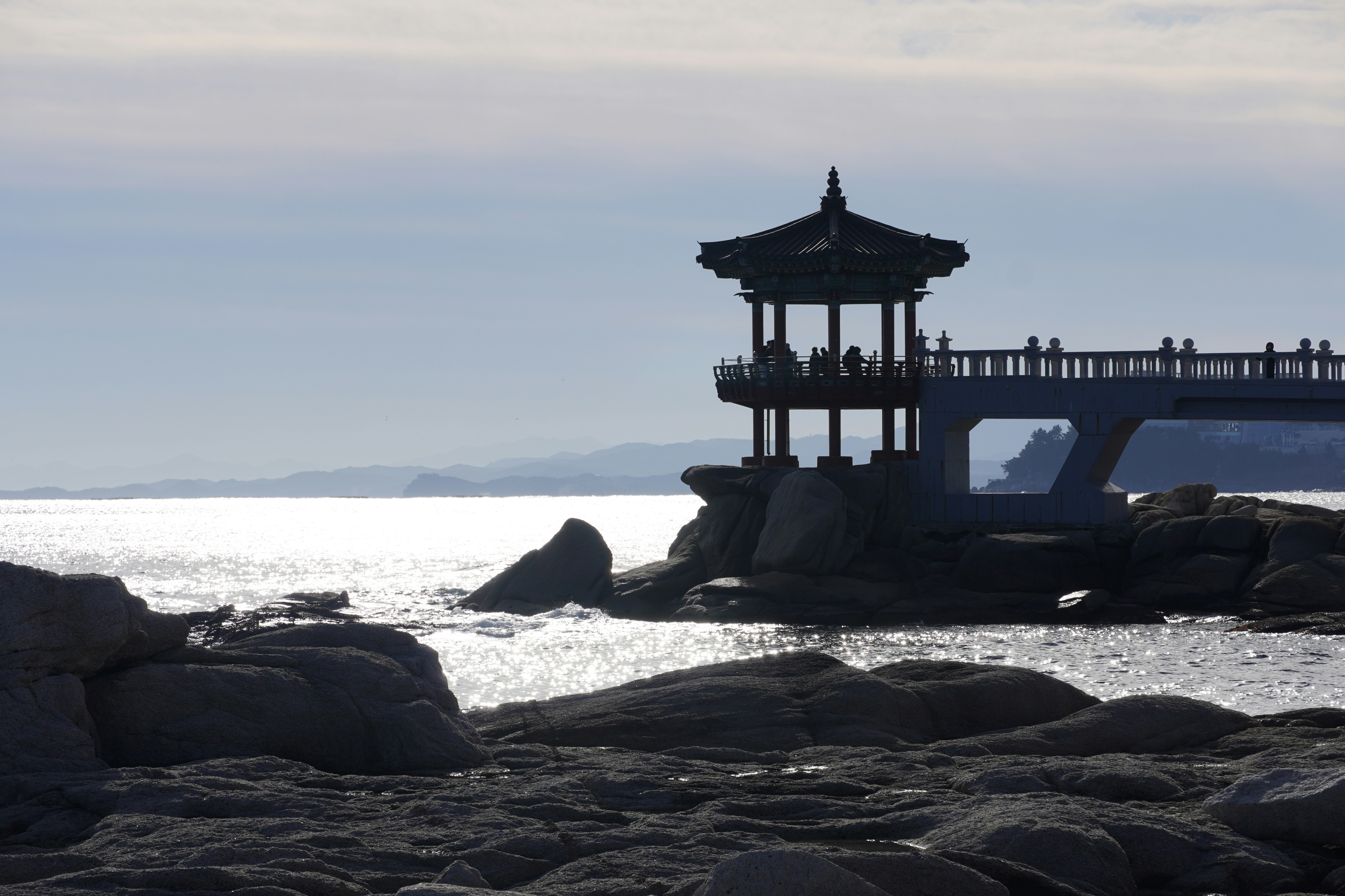 Gazebo on a rocky shore overlooking the ocean