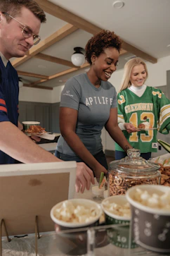 People gathered around a food buffet