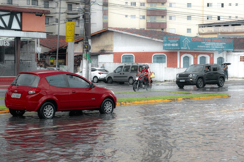 Cars driving through a flooded urban street