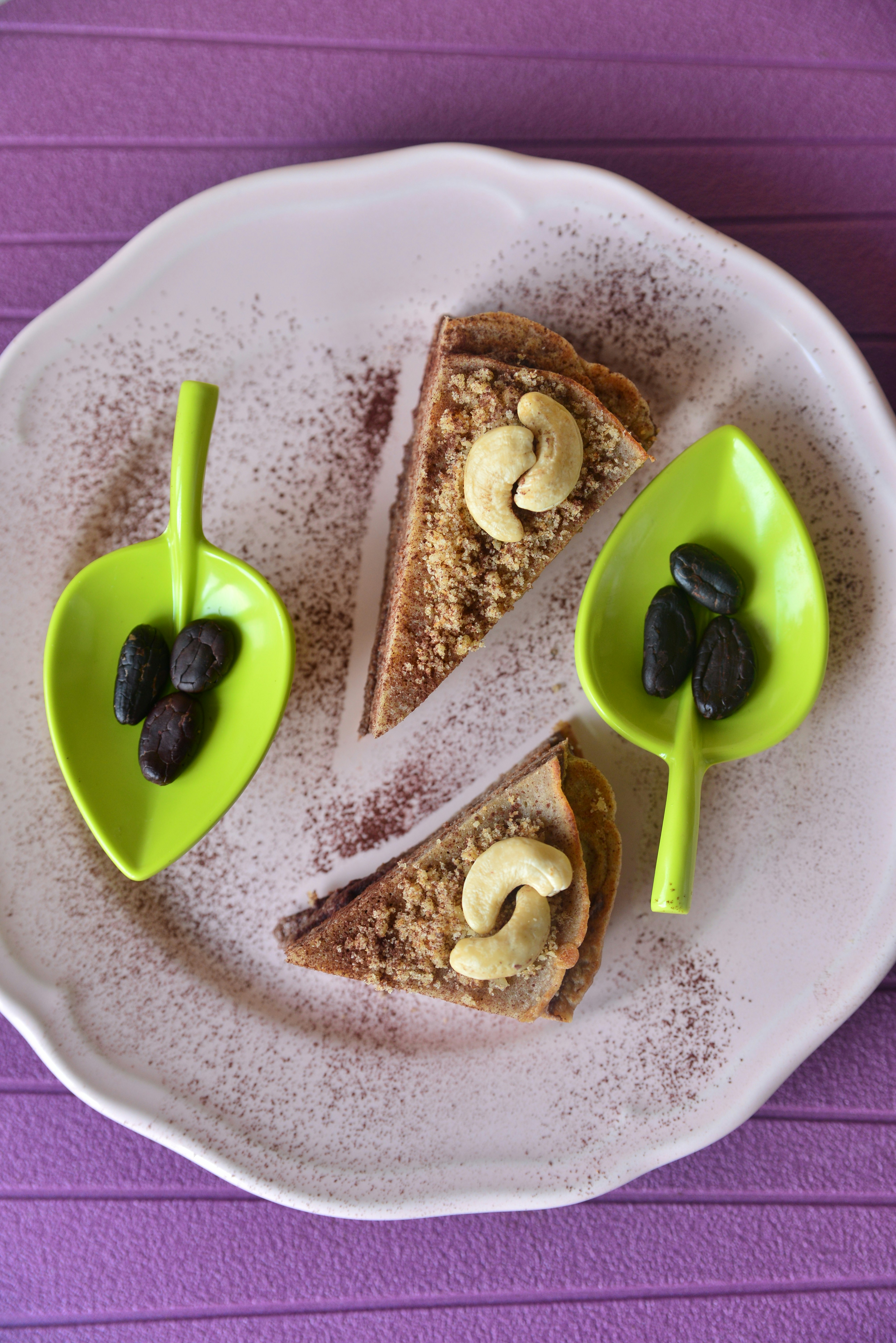Slices of cake with cashews and raisins