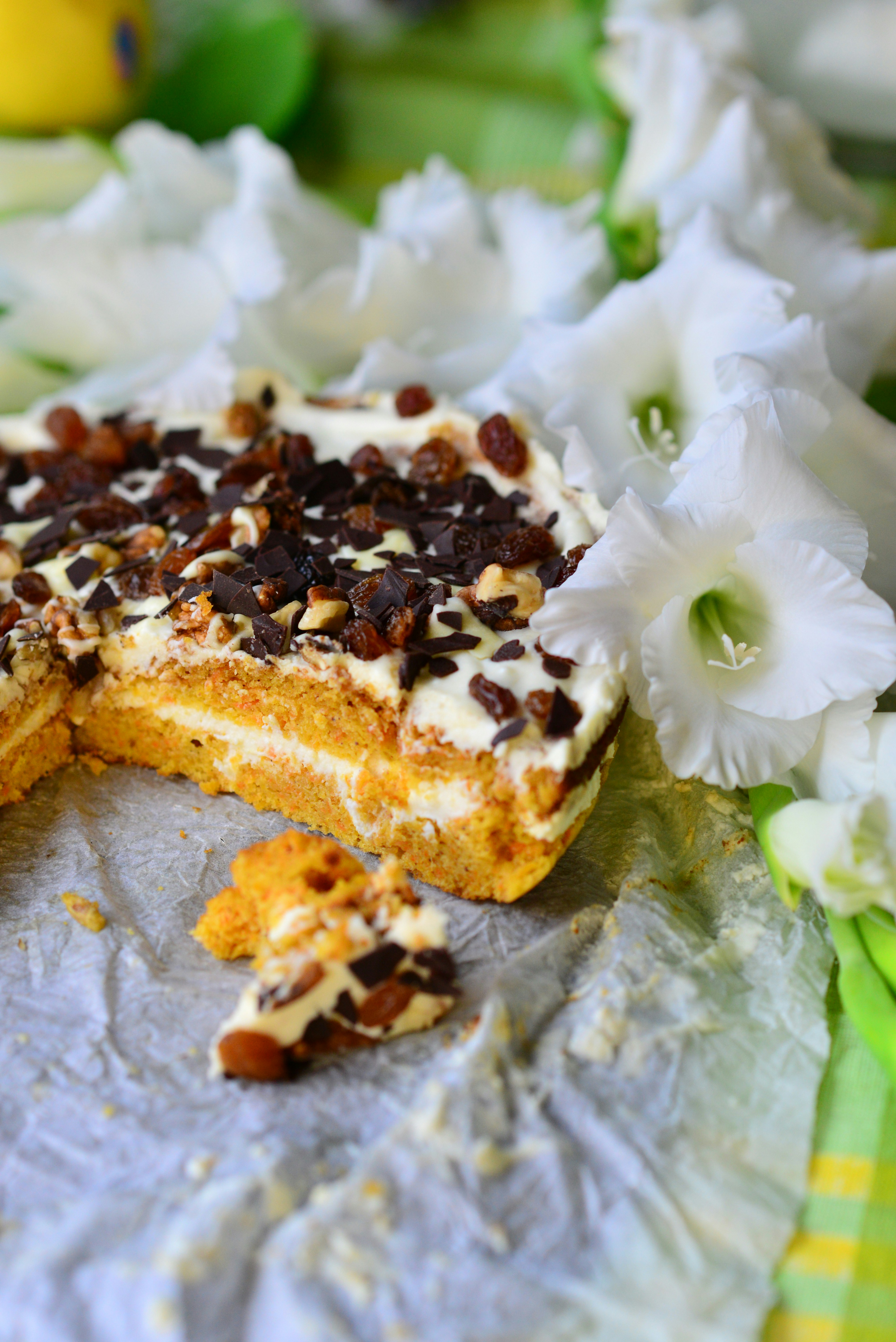 A delicious carrot cake with cream cheese frosting and nuts