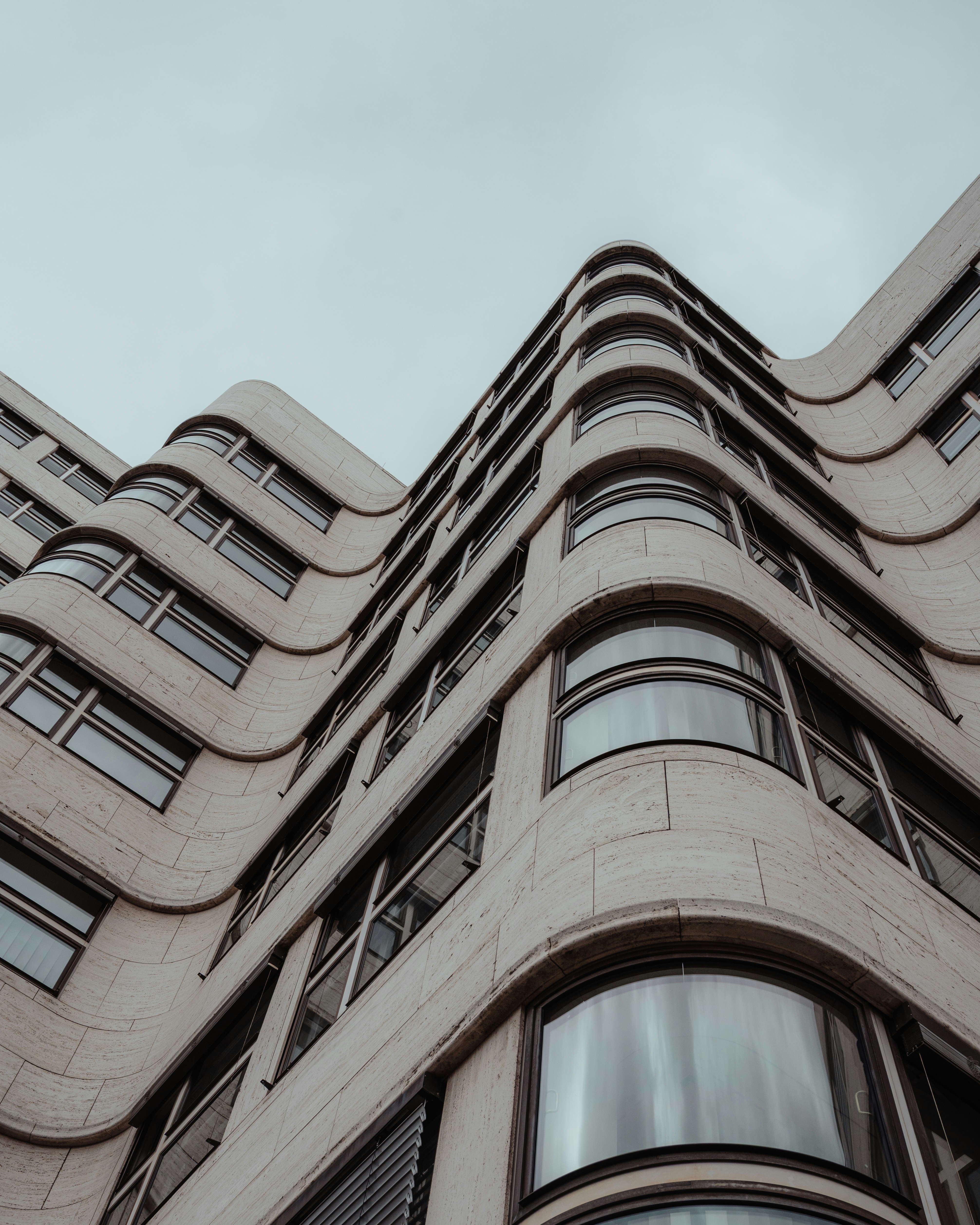 Modern building with curved facade and many windows